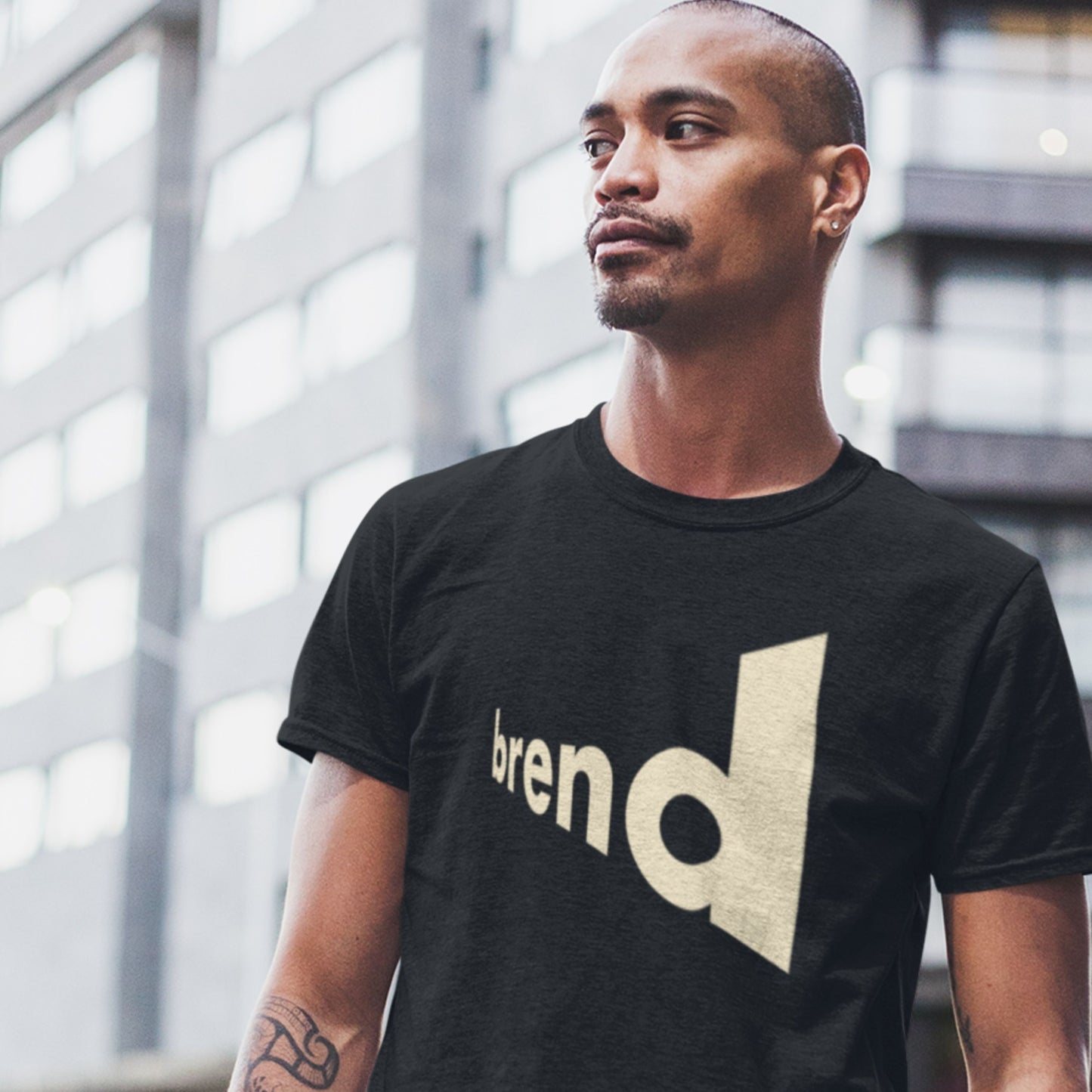 Black shirt with extreme angled text name of brend won by a model outside