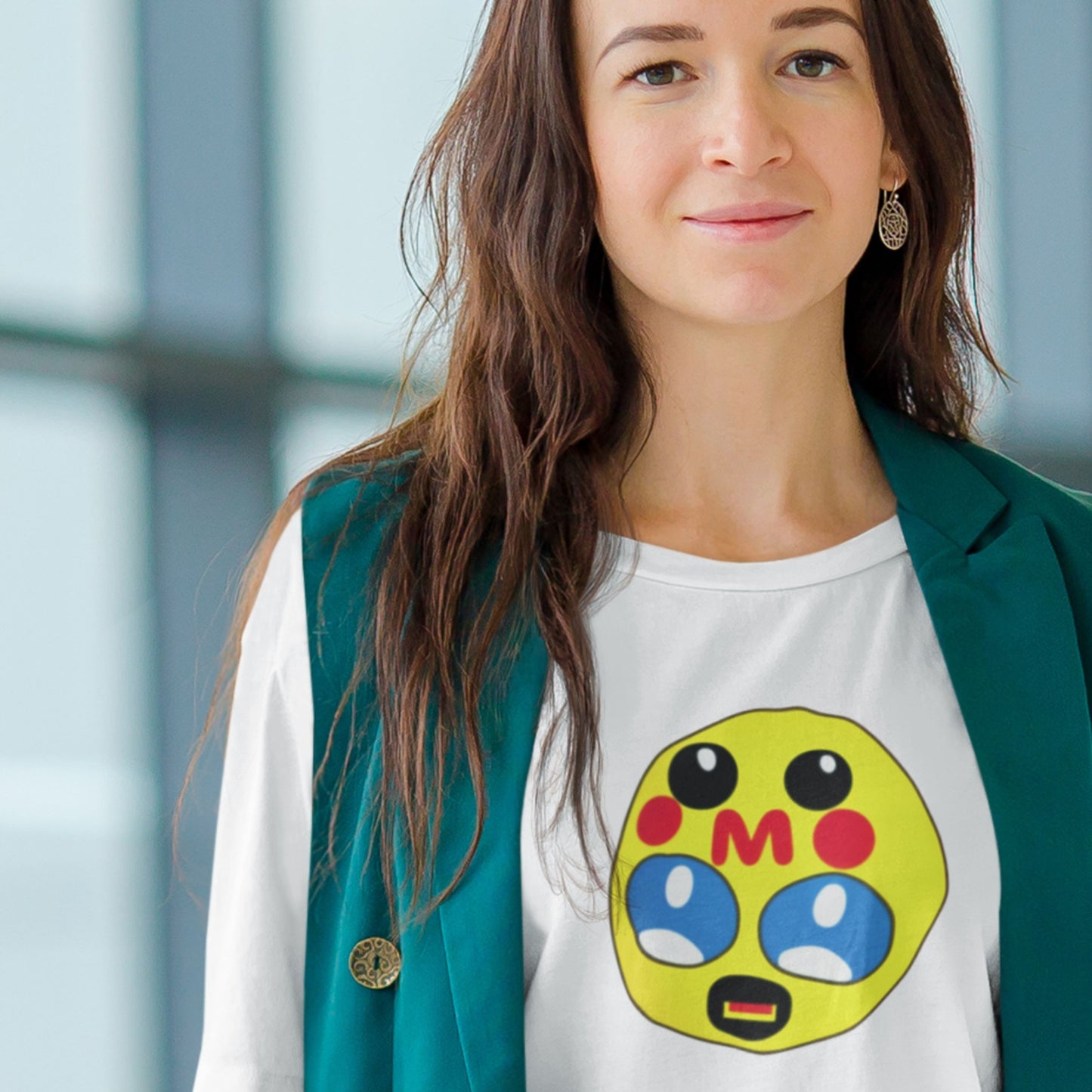 Woman wearing a white t-shirt with a colorful graphic design, standing indoors.