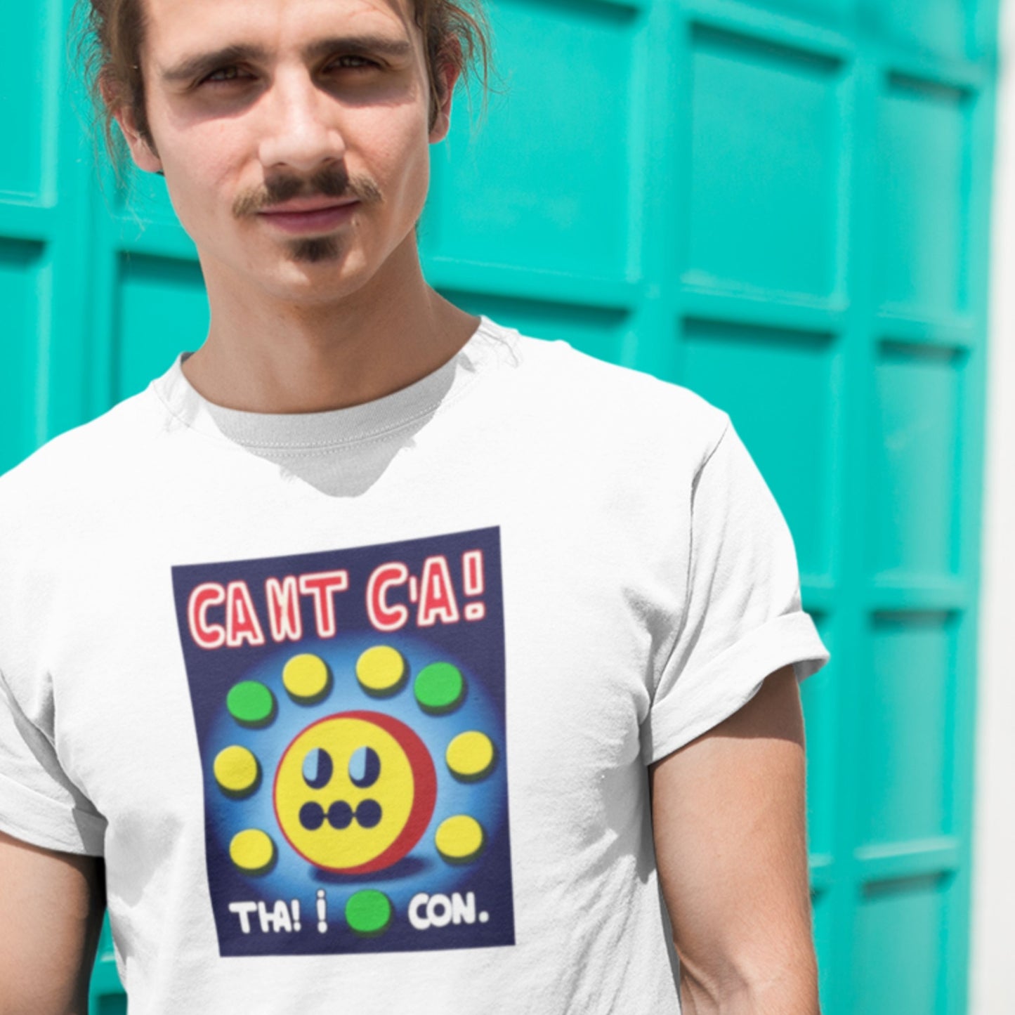 Person wearing a white t-shirt with a colorful graphic design against a turquoise background.