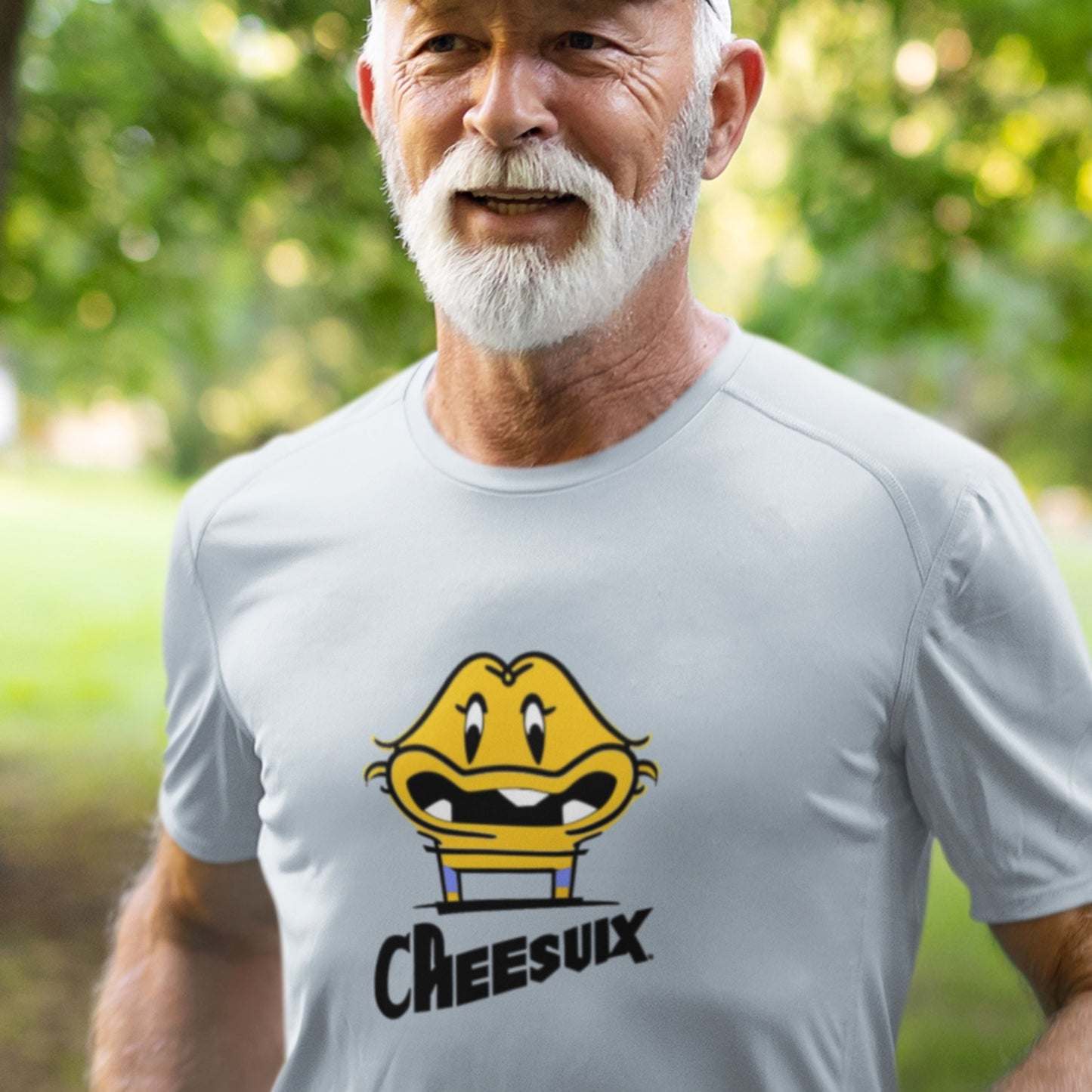 Jogging man wearing a light blue t-shirt with a fun, colorful cartoon illustration outdoors.