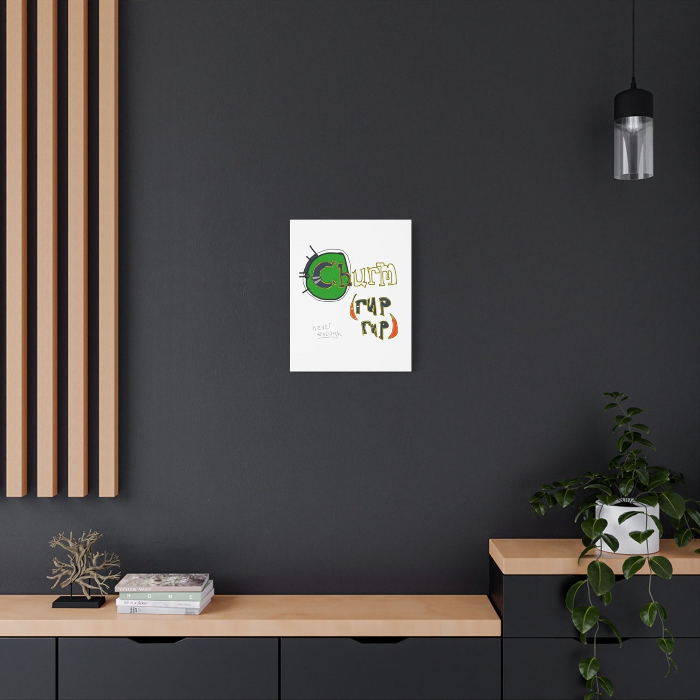 Abstract graffiti-esque design on a dark wall above a wooden shelf.