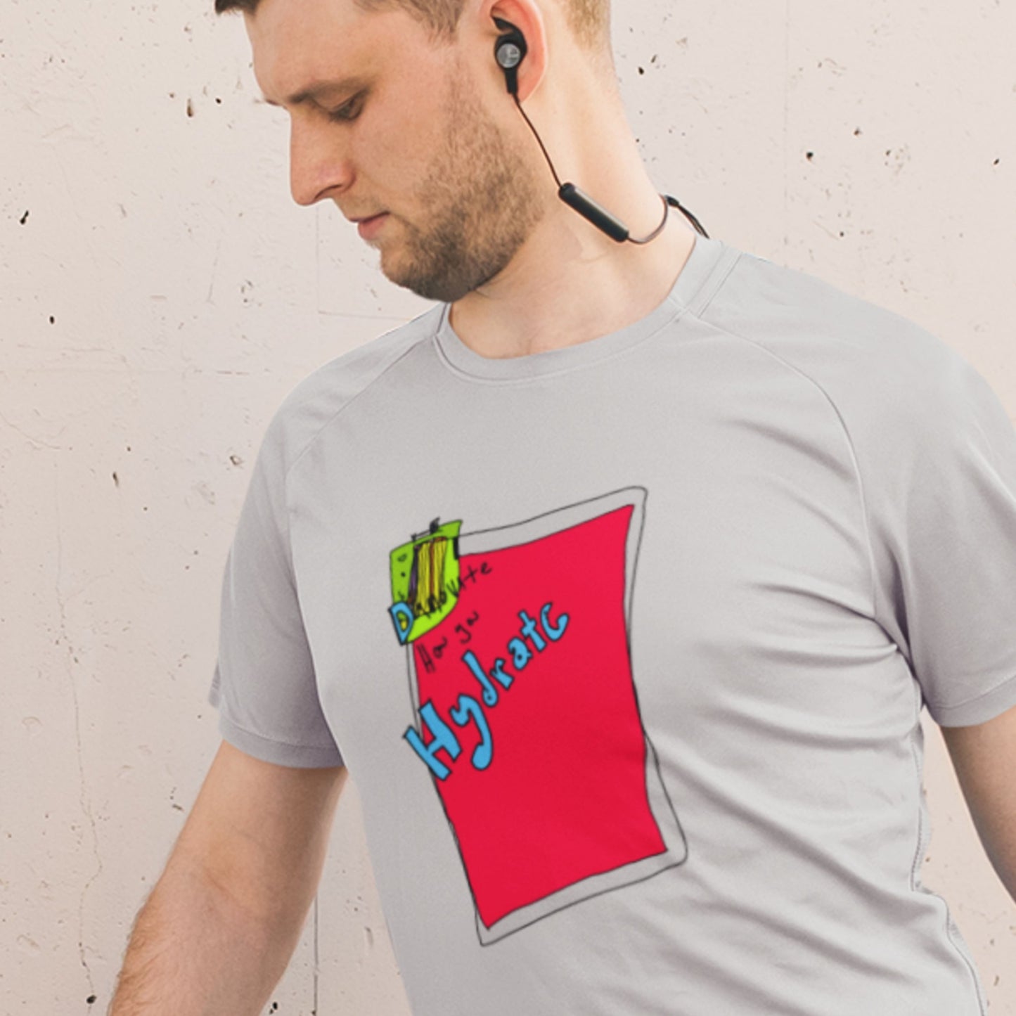 Stretching man wearing a light grey t-shirt with a colorful abstract drawing on a grey background.
