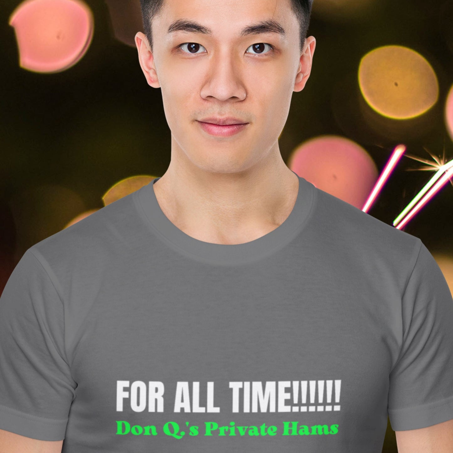 Man wearing a gray t-shirt with text in front of a blurred colorful background.