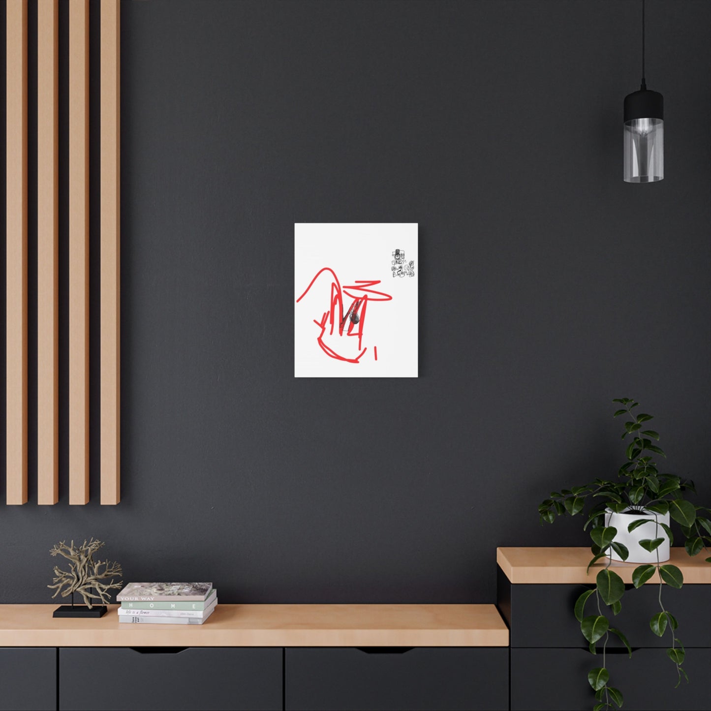 Abstract drawing on a white canvas hung on a dark wall with wooden shelves and decor.