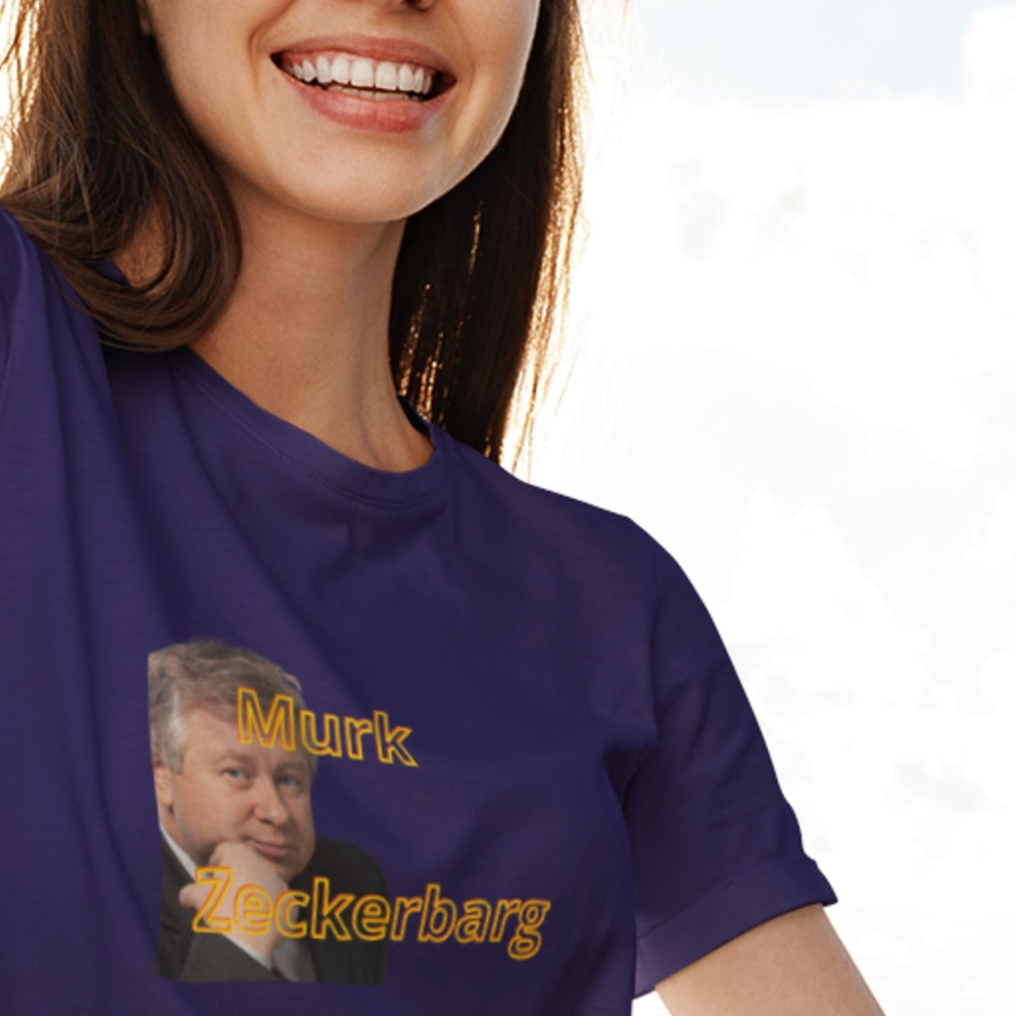 Person wearing a purple t-shirt with a graphic and text, on a plain background.