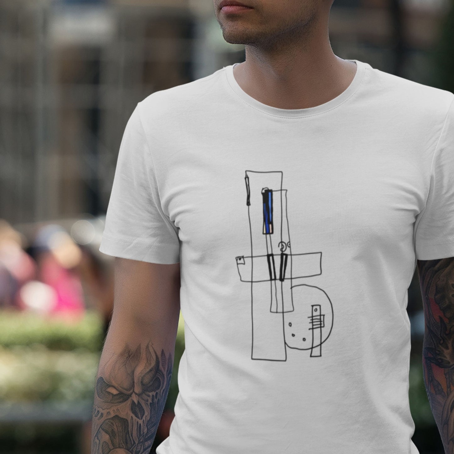 Headless man wearing a white t-shirt with an abstract drawing outdoors.