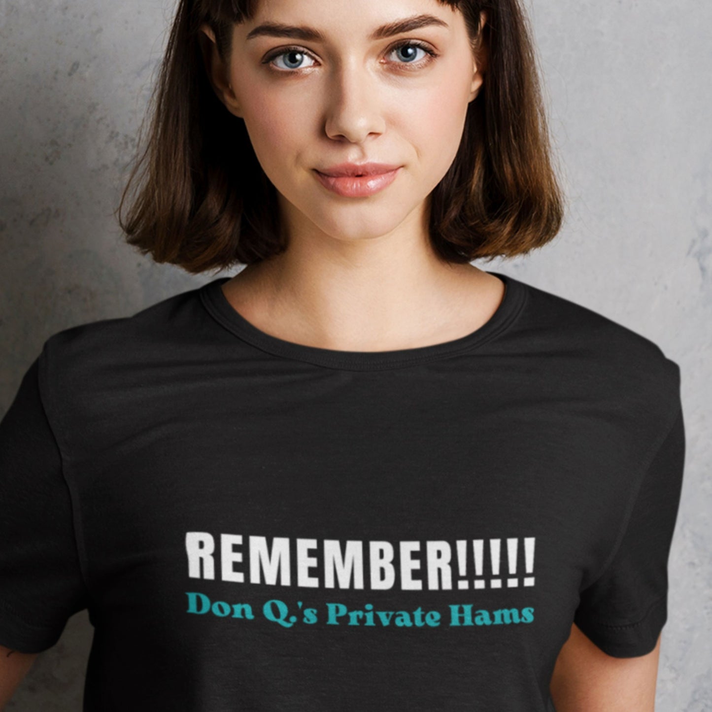 Person wearing a black t-shirt with humorous text design.