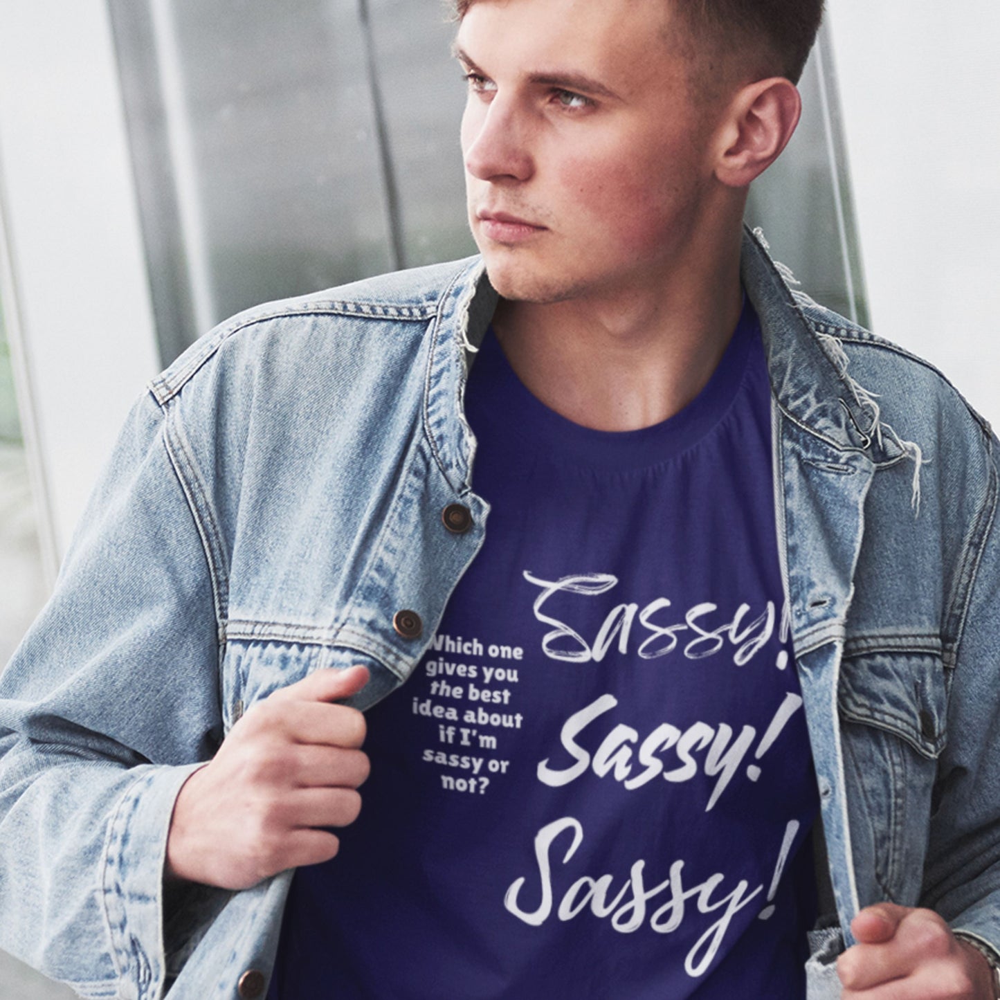 Man wearing a denim jacket over a purple t-shirt with 'Sassy! Sassy! Sassy!' text.
