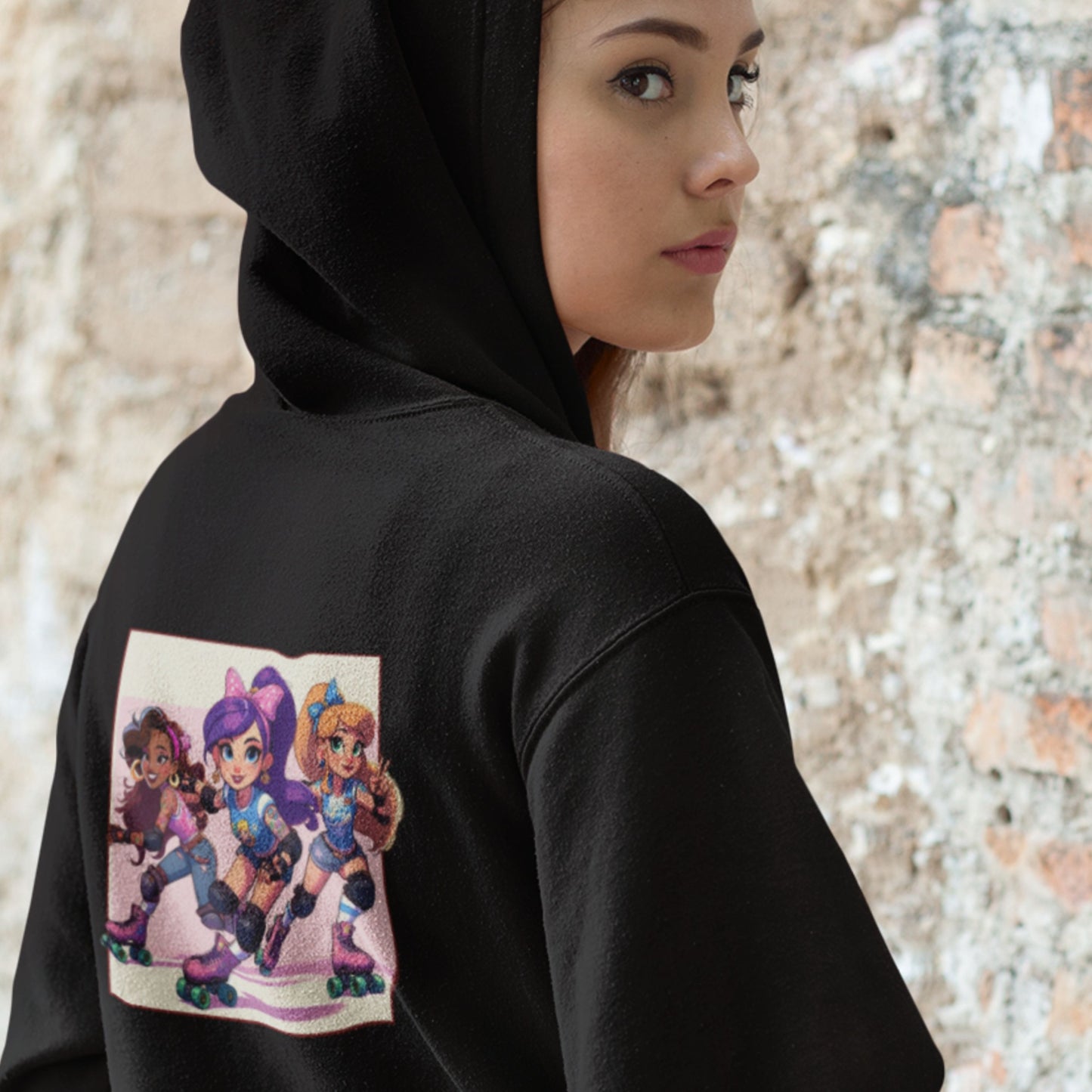 Person wearing a black hoodie with a colorful graphic on the back, standing against a textured wall.