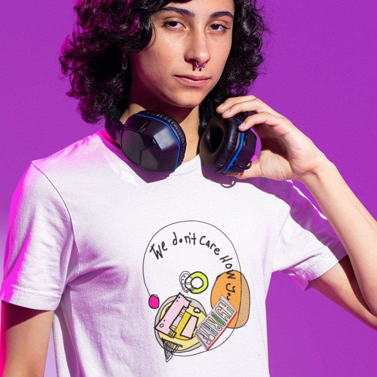Man wearing a white t-shirt with a colorful abstract drawing on a purple background.
