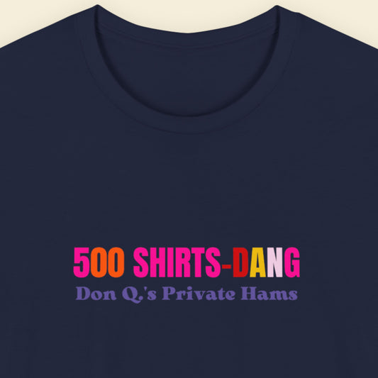 Navy t-shirt with humorous colorful text on a beige background.