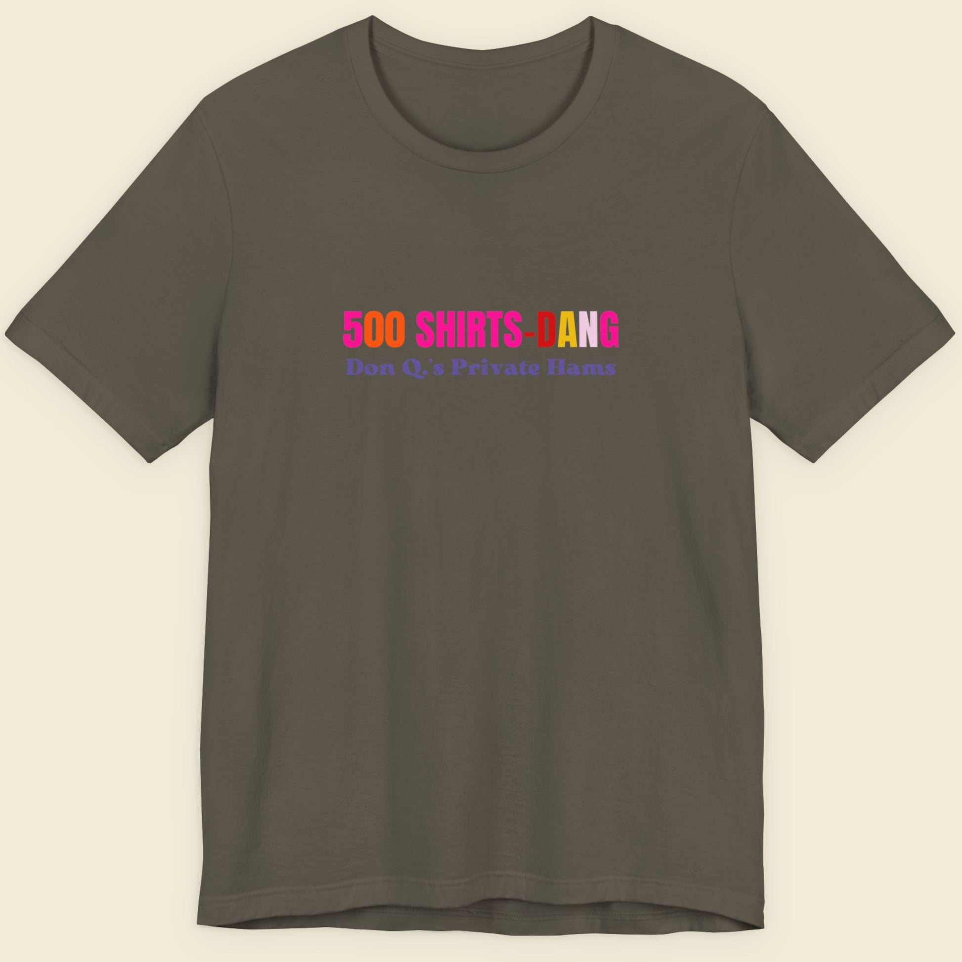 Army green t-shirt with humorous colorful text on a beige background.