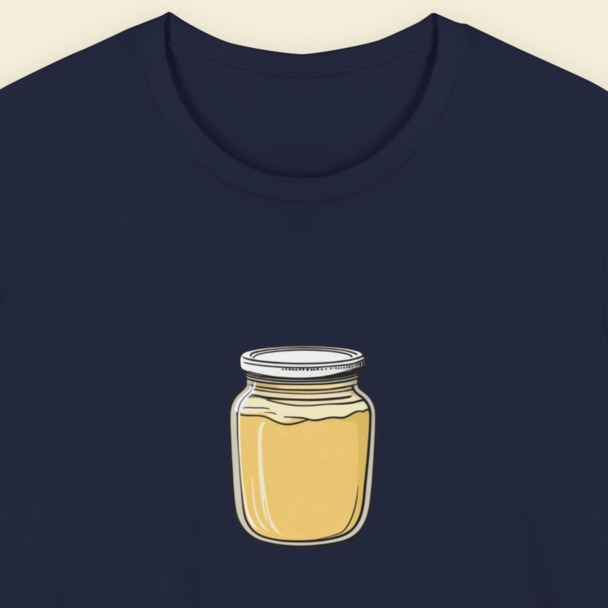 Navy blue t-shirt with an illustration of a jar of dijon on a beige background.
