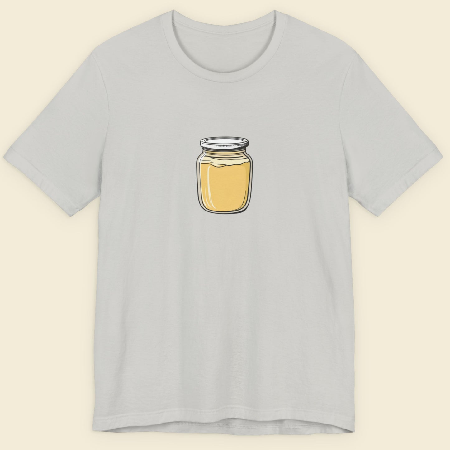 Light gray t-shirt with a jar of Dijon mustard graphic on a beige background.