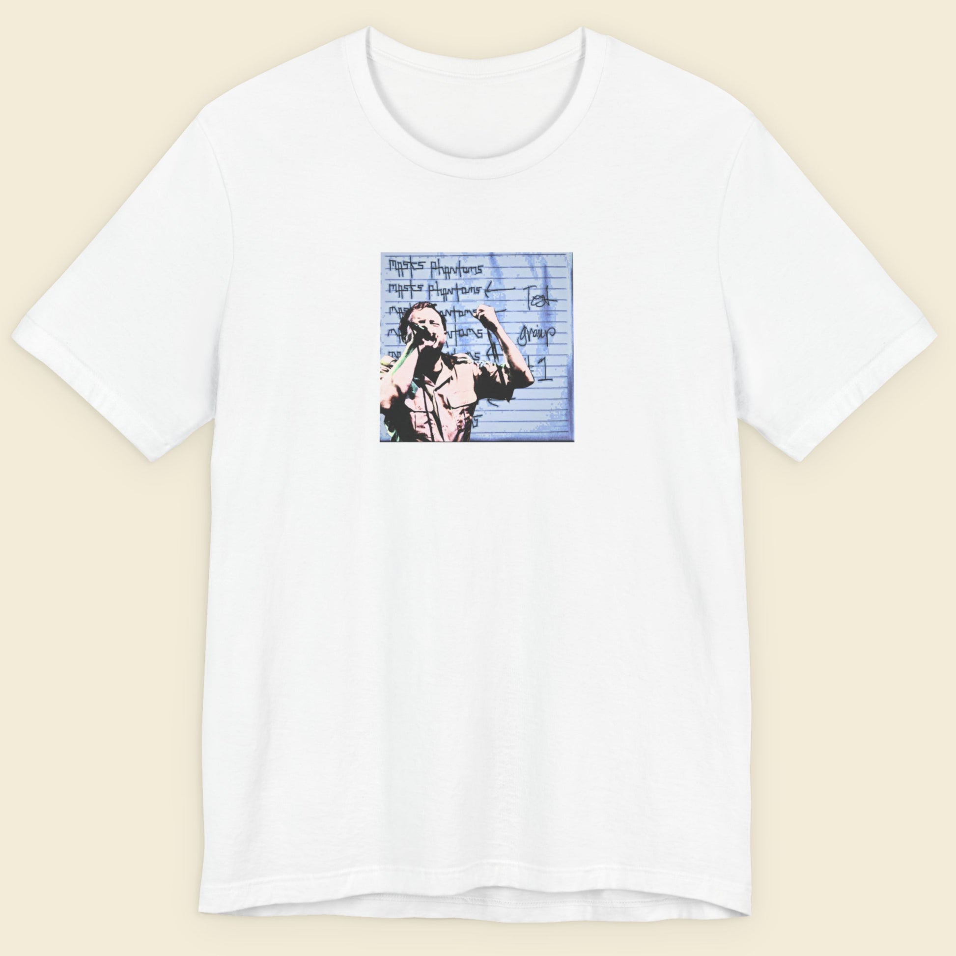 White t-shirt with graphic design on a beige background