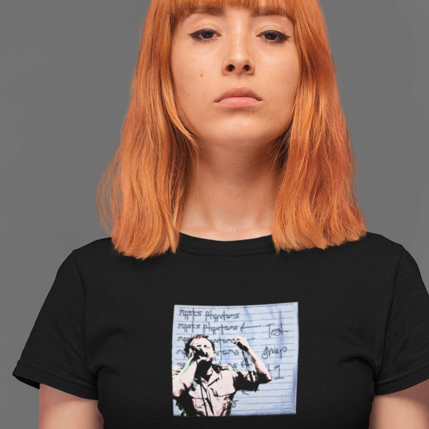 woman wearing a black shirt with blue and white music graphic design for the band masks phantoms