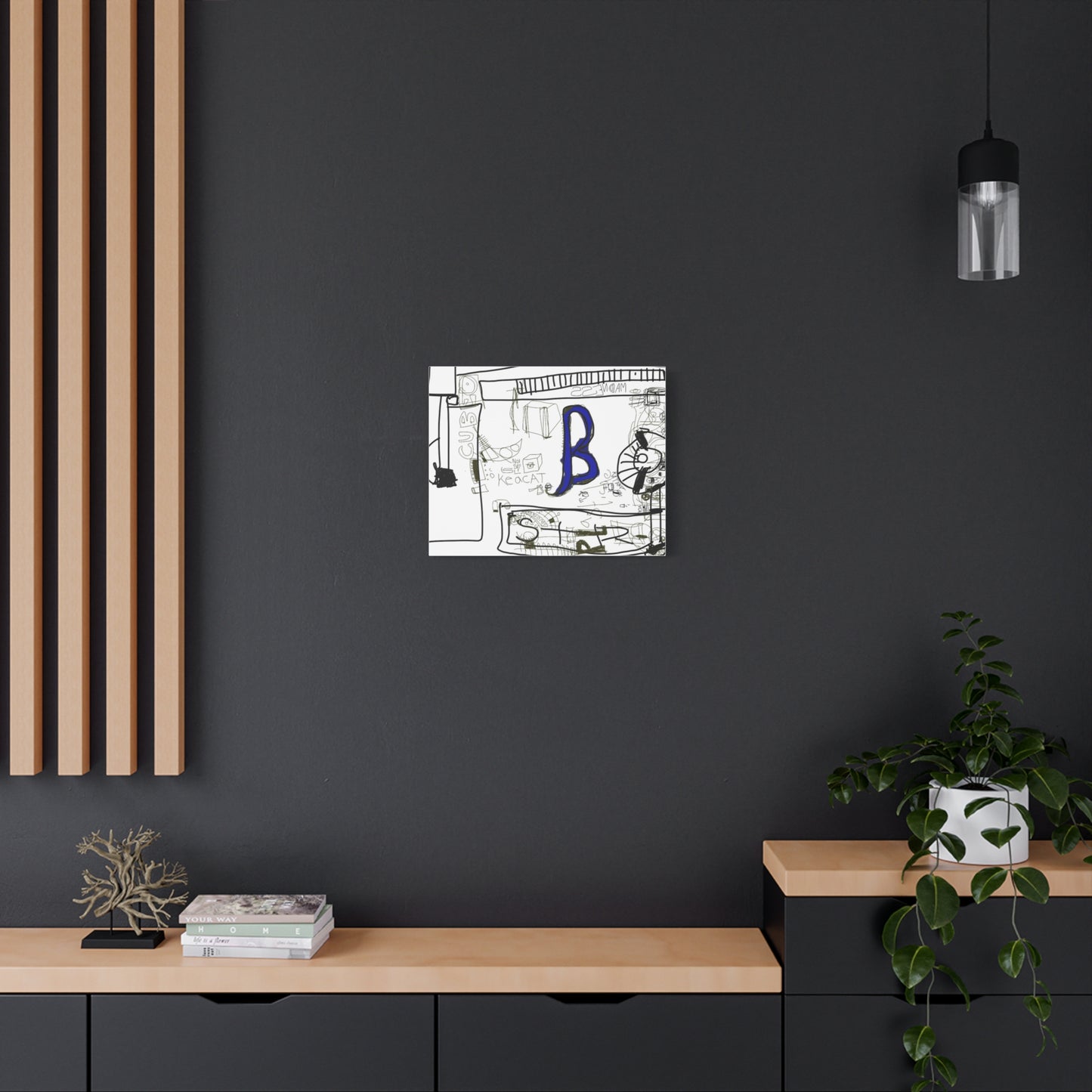Abstract artwork with a blue letter 'B' on a dark wall above a wooden shelf.
