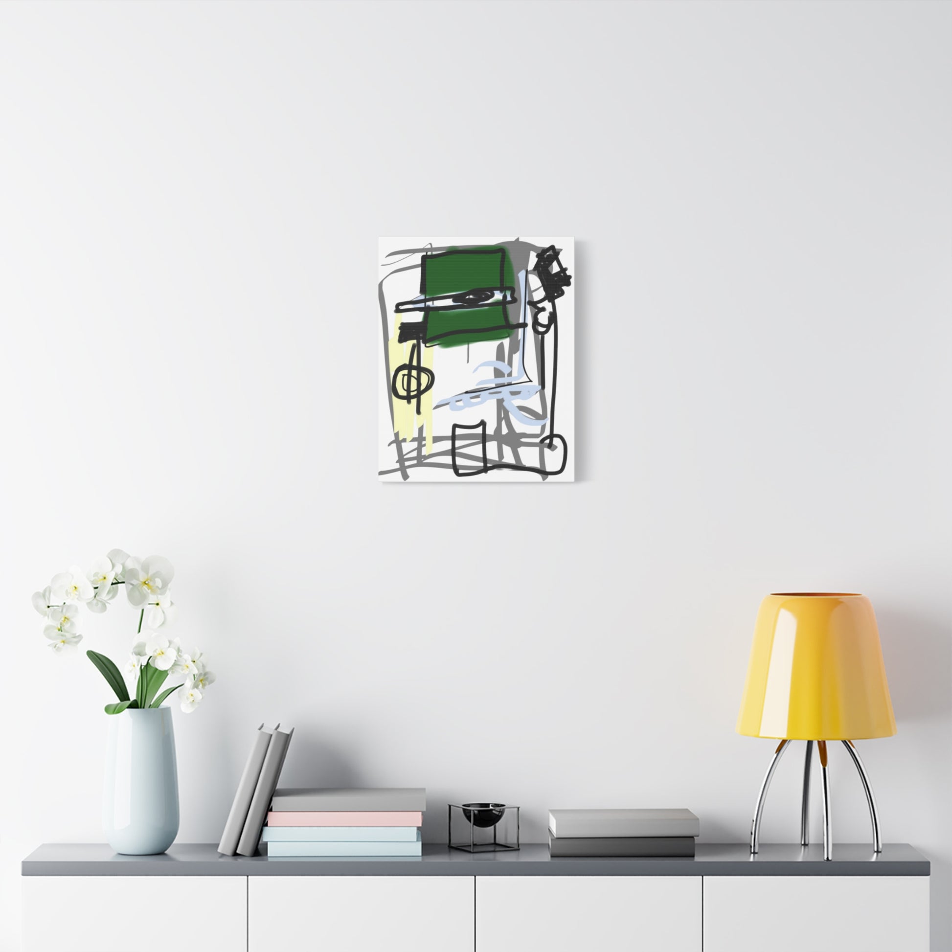 Modern wall art piece on a white wall above a shelf with decor items.