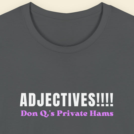 Grey t-shirt with humorous colorful text on a beige background.