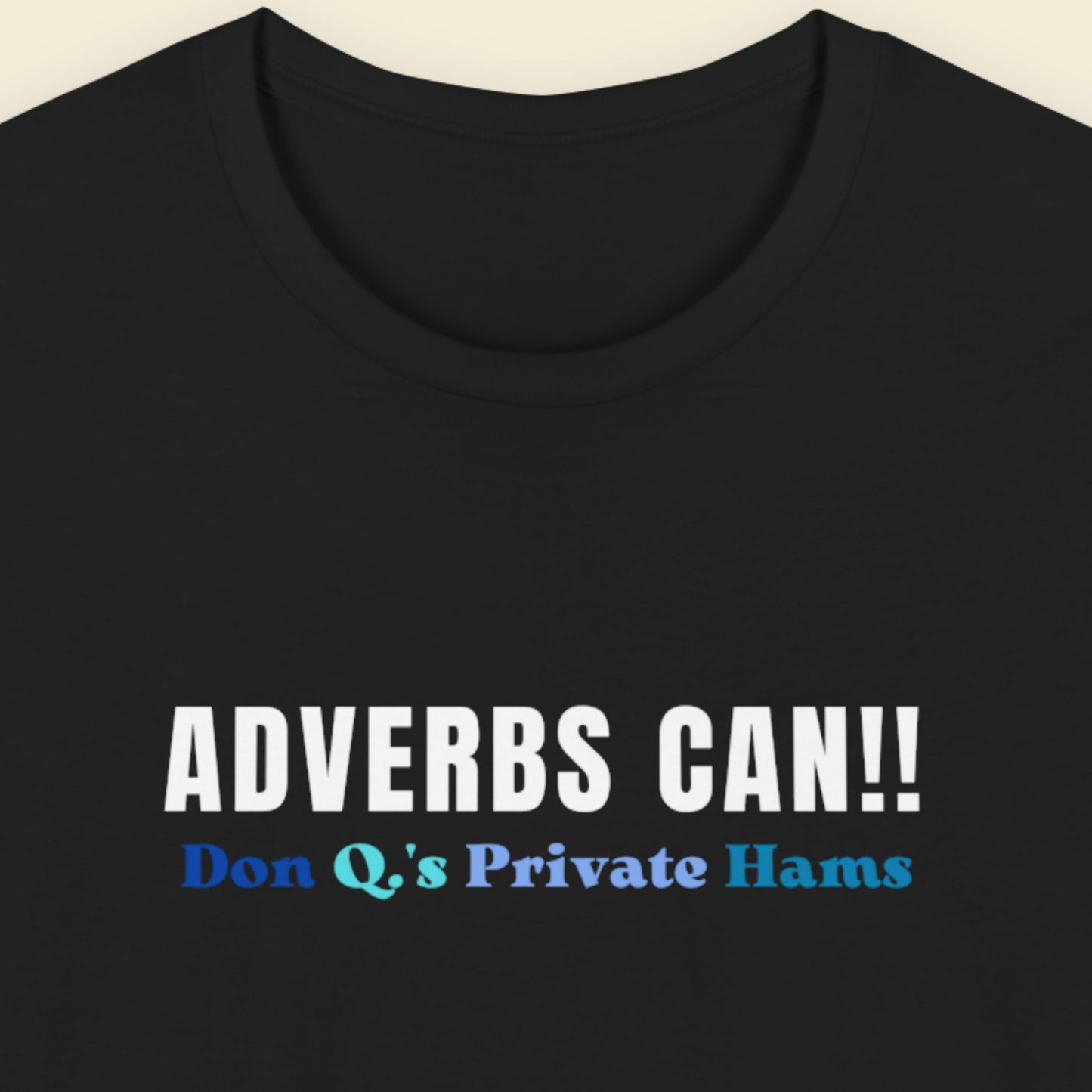 Black t-shirt with text 'ADVERBS CAN!! Don Q's Private Hams' on a beige background.