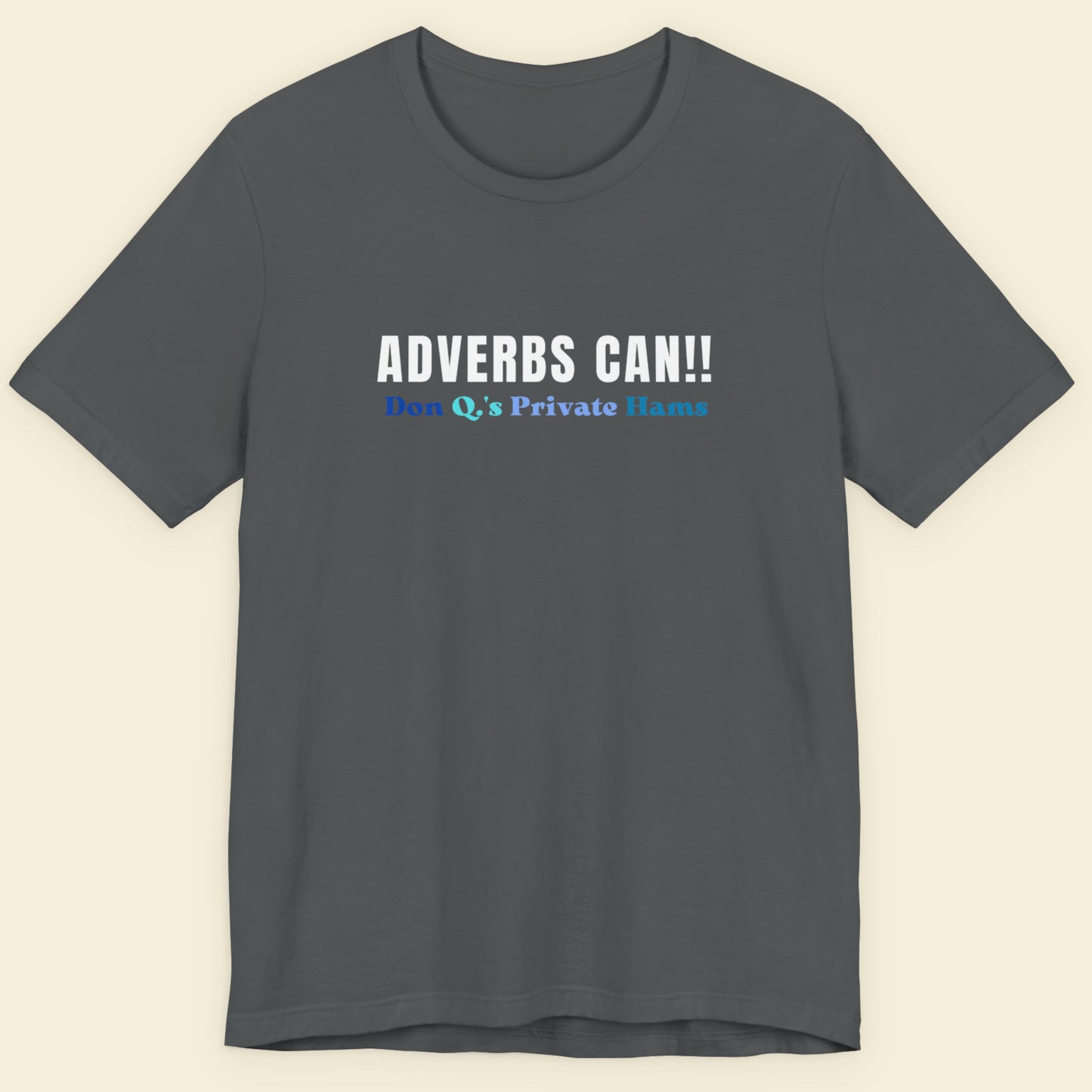 Gray t-shirt with text 'ADVERBS CAN!! Don Q's Private Name' on a beige background.