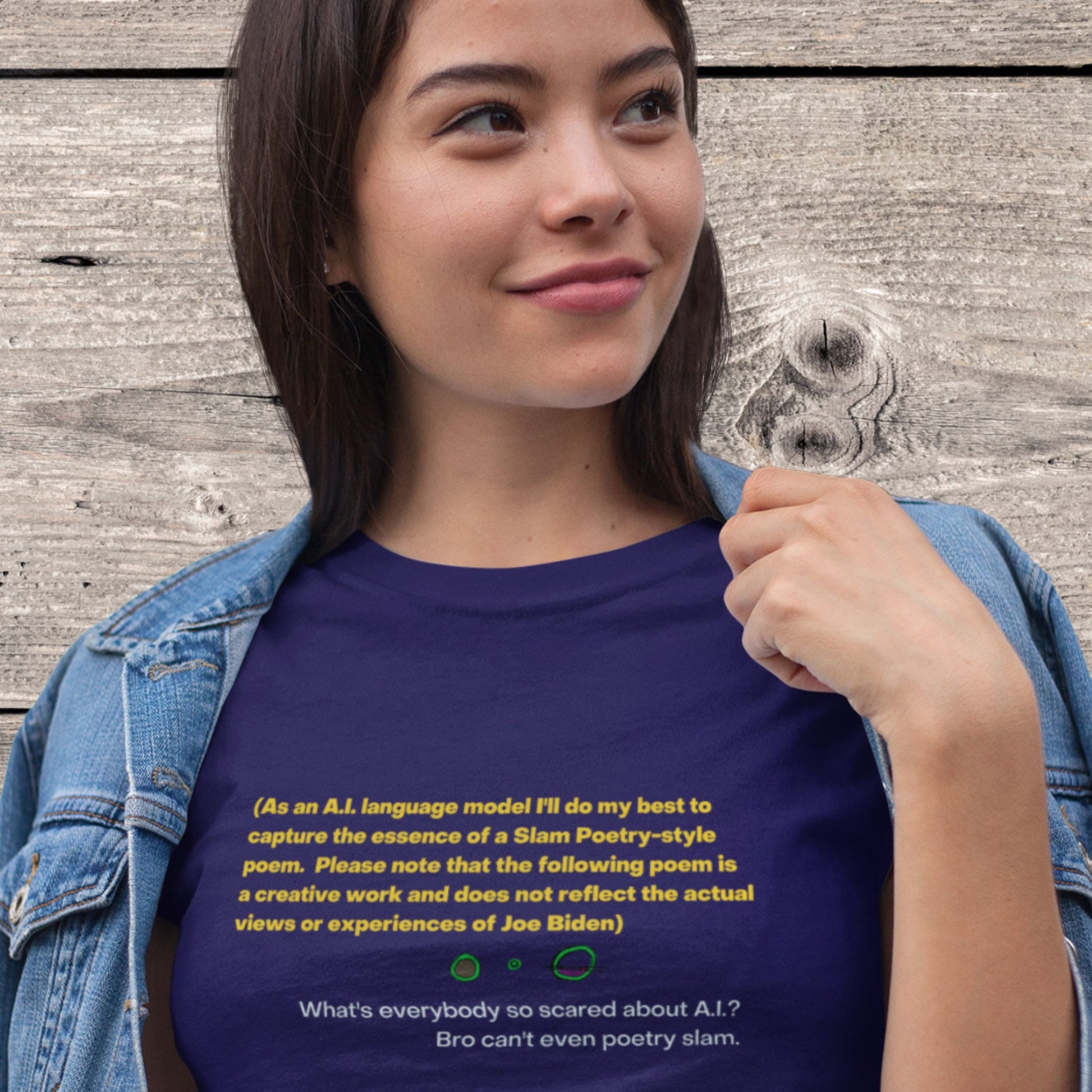 Woman wearing a navy blue t-shirt with humorous colorful text on a wooden background.