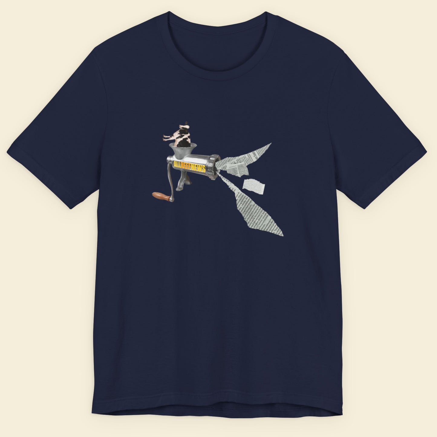Navy blue t-shirt with a fun, colorful cartoon illustration on a beige background.