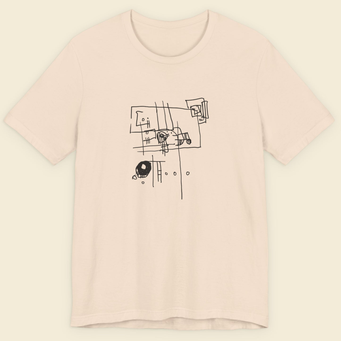 Cream colored t-shirt with an abstract line drawing on a beige background.