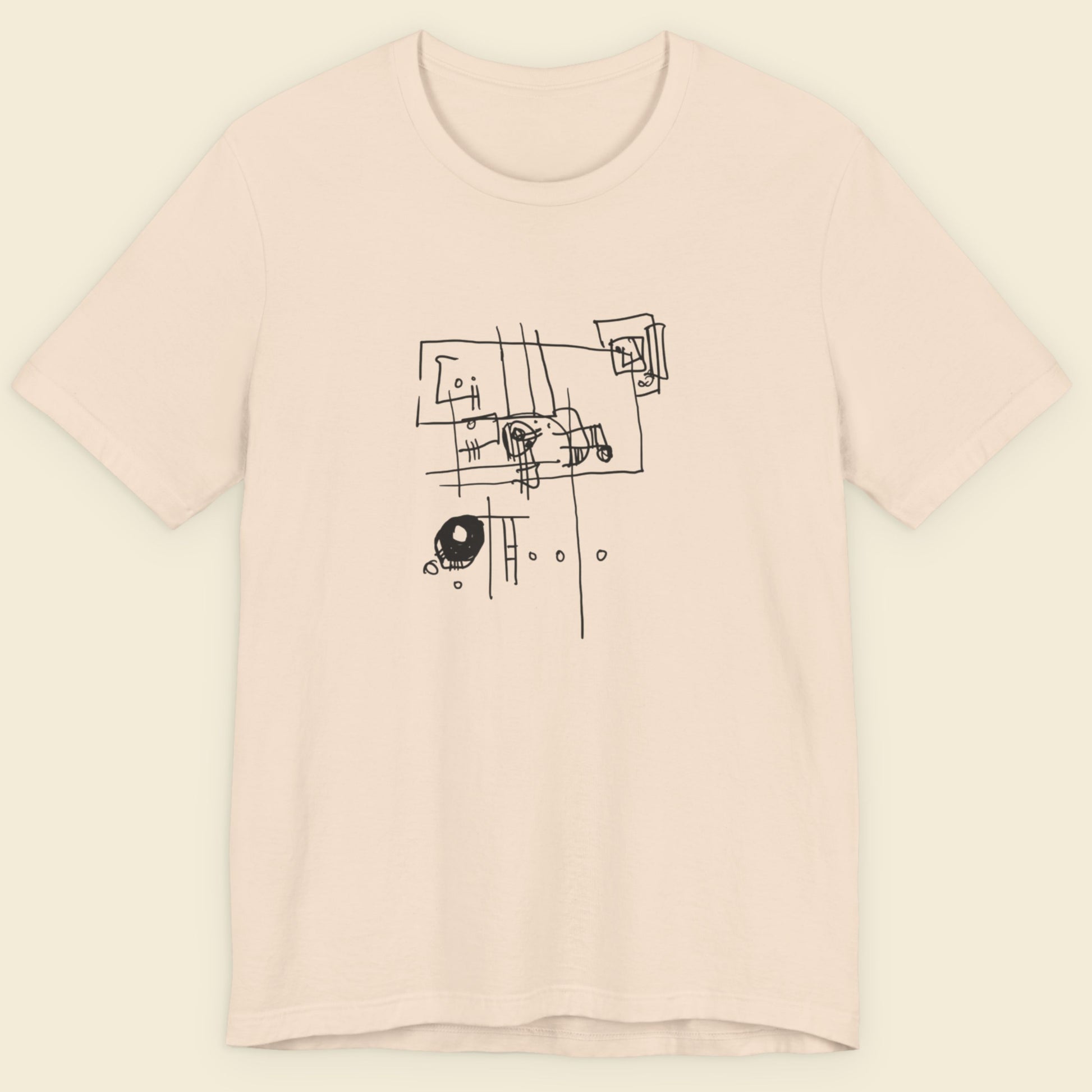 Cream colored t-shirt with an abstract line drawing on a beige background.
