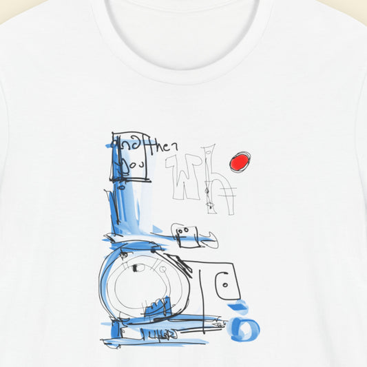 White t-shirt with a colorful abstract drawing on a beige background.