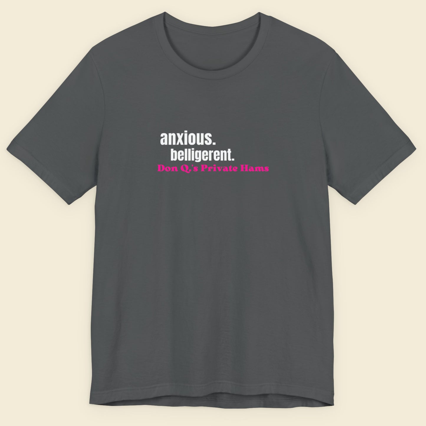 Gray t-shirt with text on a beige background.