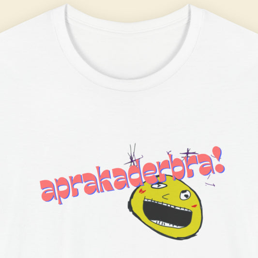 White t-shirt with a fun, colorful cartoon illustration on a beige background.