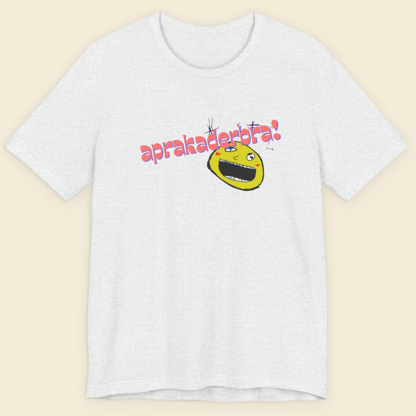 Ash grey t-shirt with a fun, colorful cartoon illustration on a beige background.
