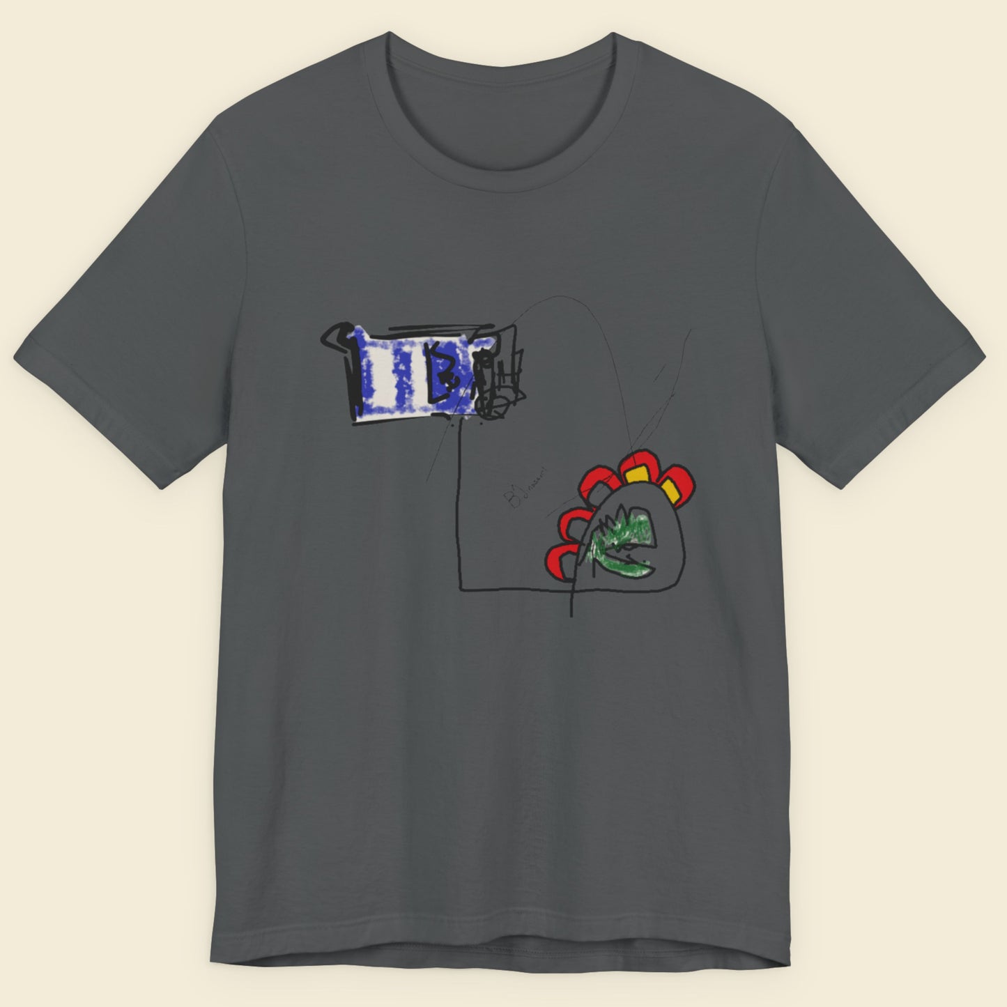 Grey t-shirt with a colorful abstract drawing on a beige background.