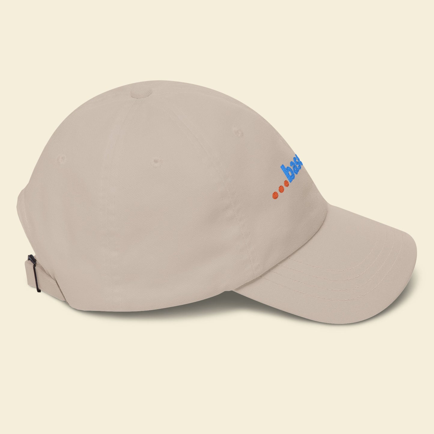 Beige cap with a logo on a beige background.