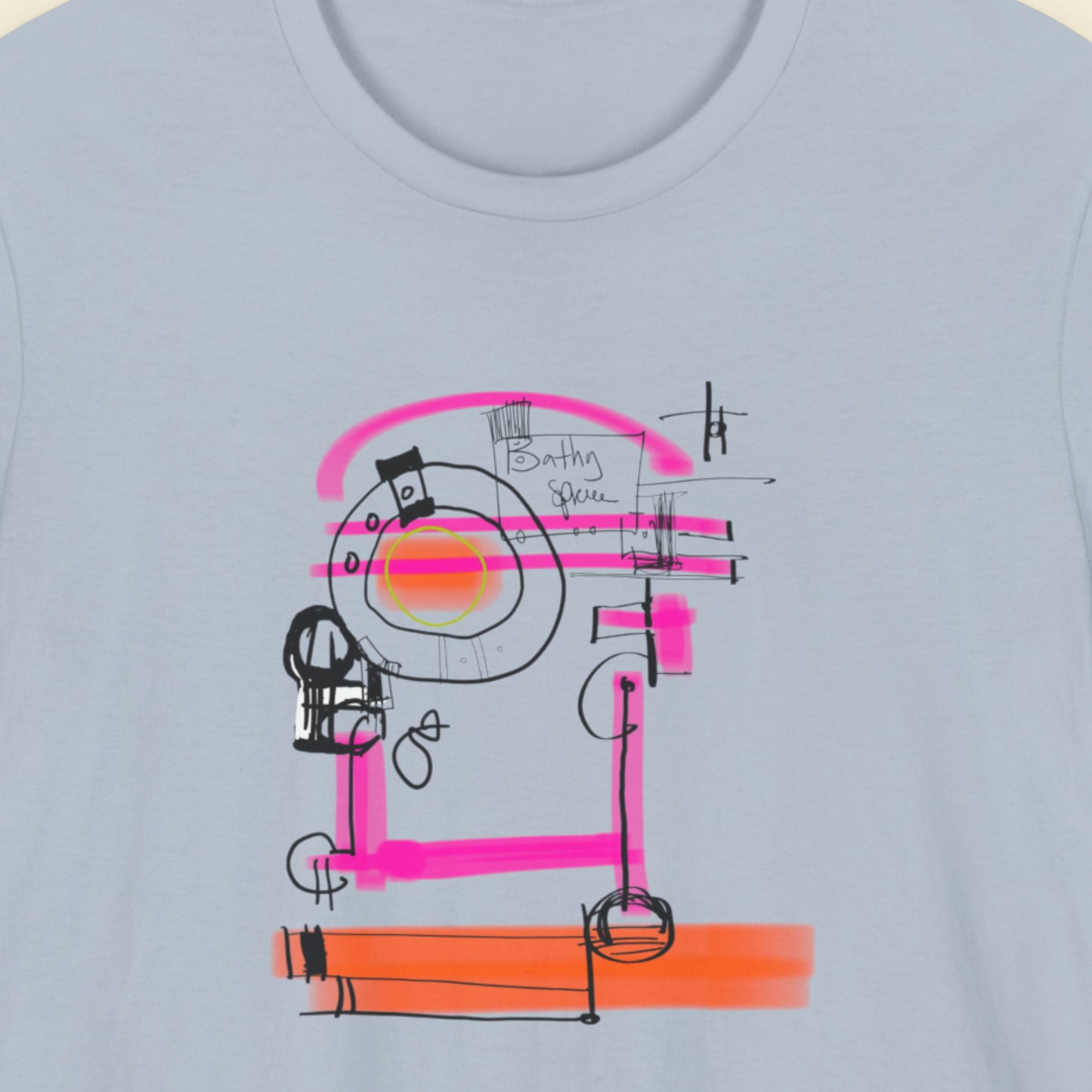 Blue t-shirt with a colorful abstract drawing on a beige background.