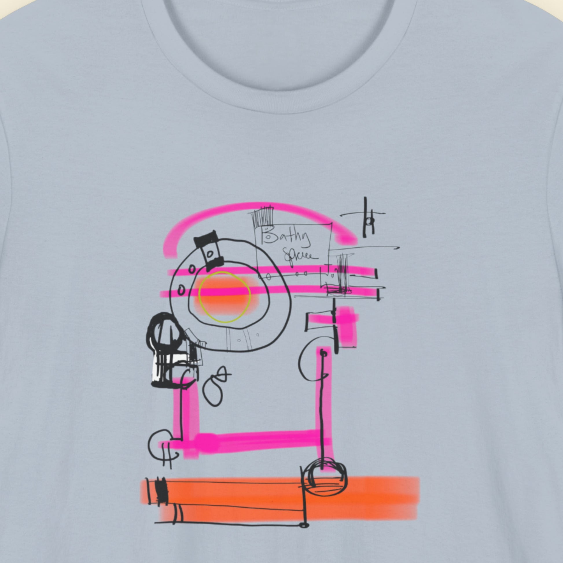 Blue t-shirt with a colorful abstract drawing on a beige background.