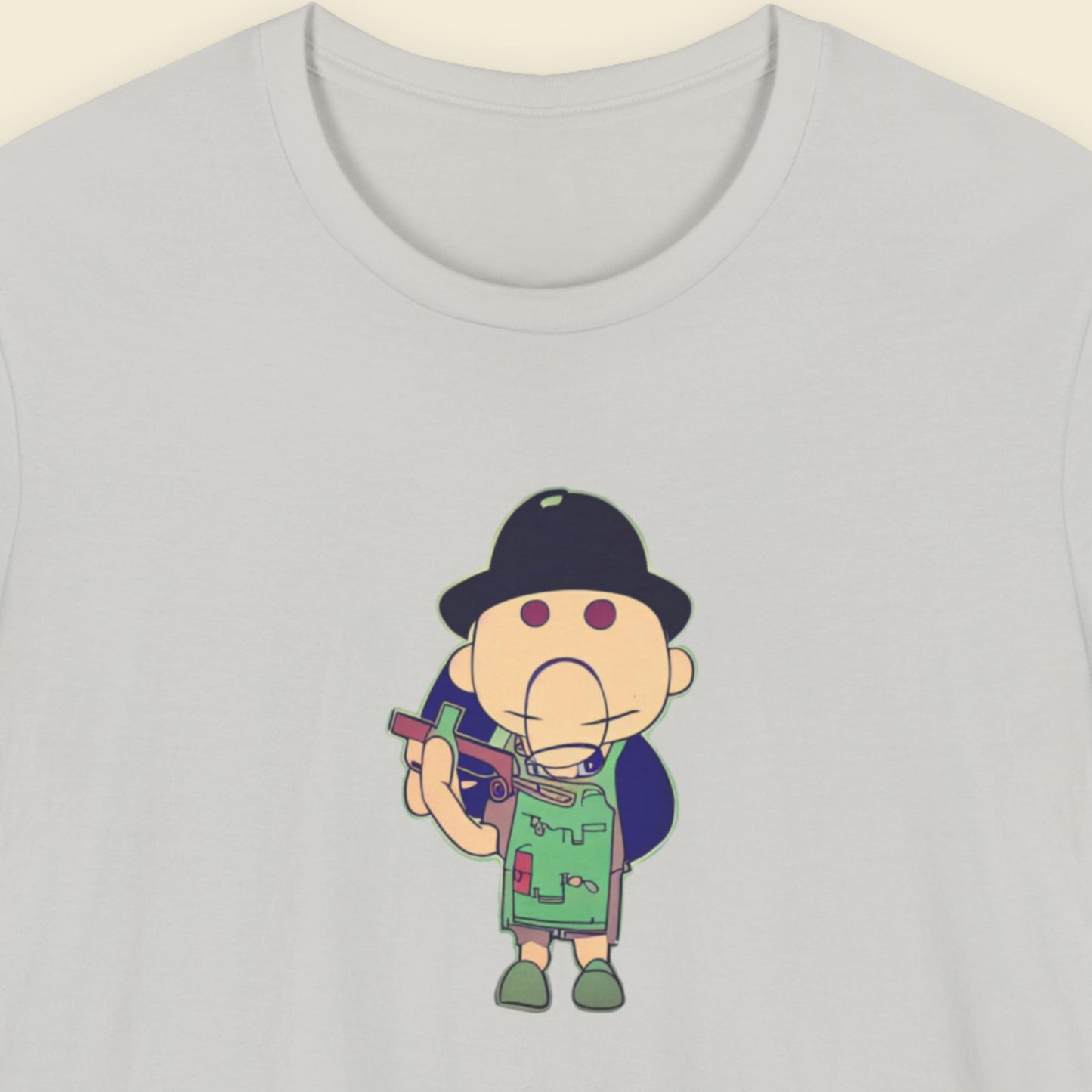 Grey t-shirt with a fun, colorful cartoon illustration on a beige background.