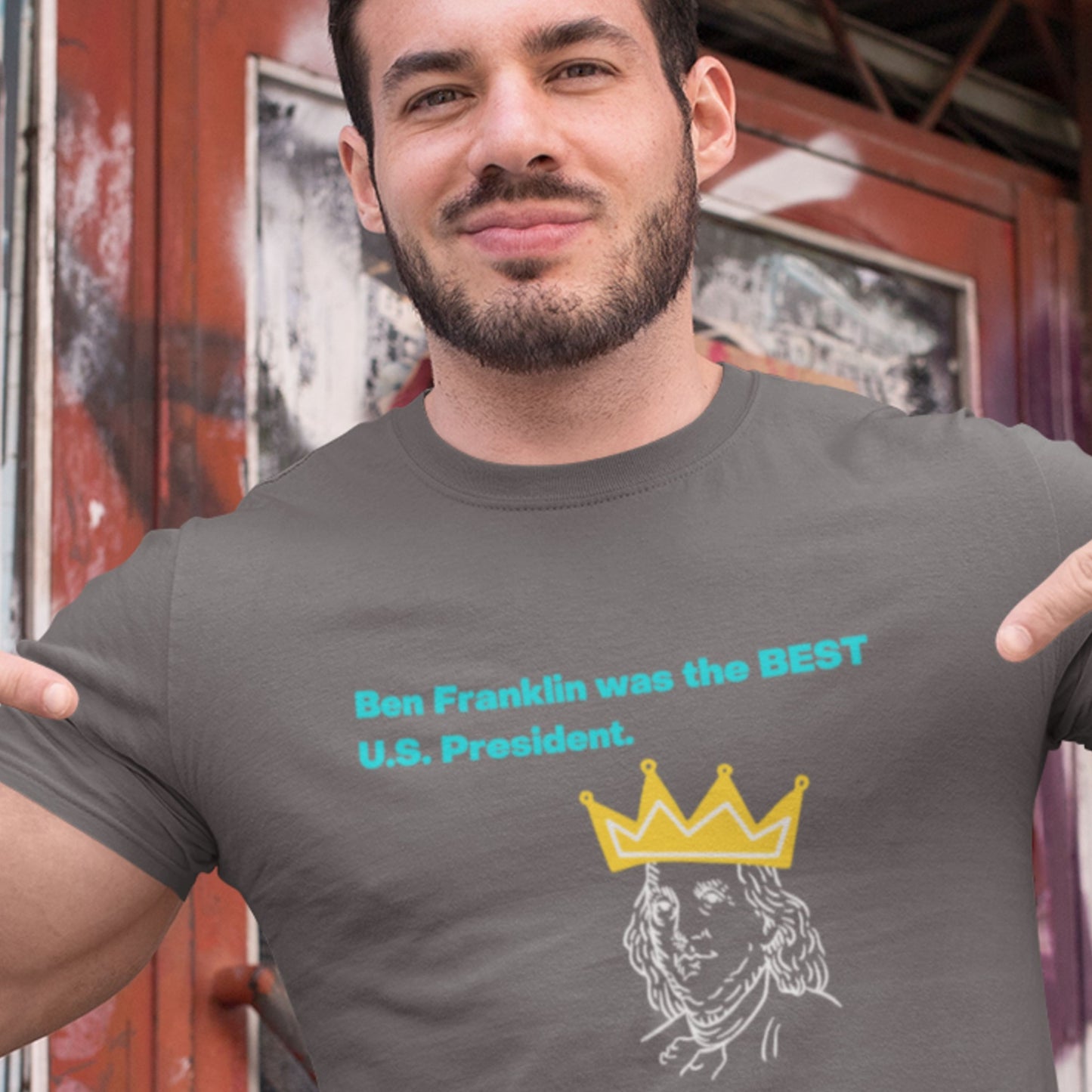 Man wearing a t-shirt with a graphic and text about Benjamin Franklin.