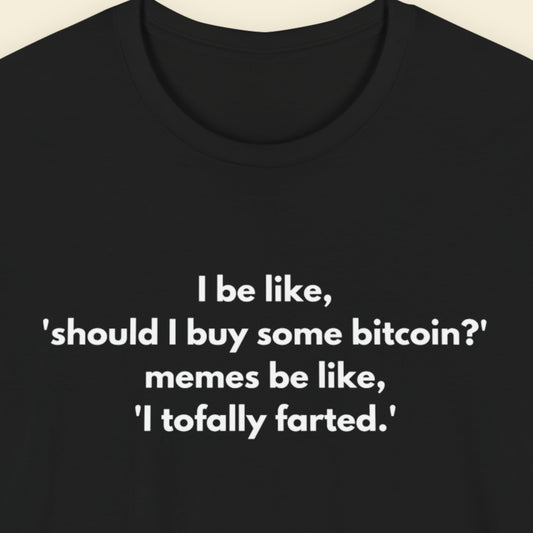 Black t-shirt with humorous text on a beige background.
