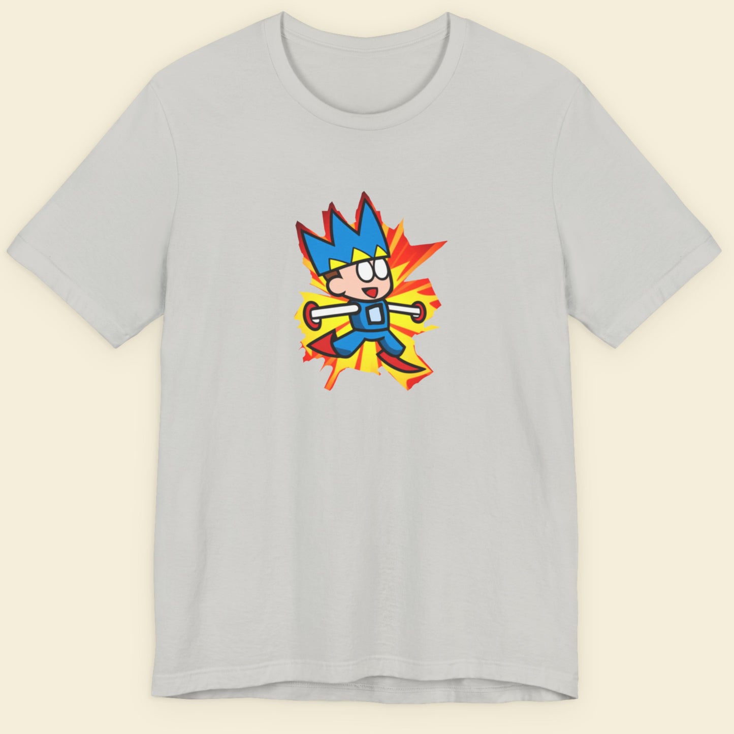 Light grey t-shirt with a fun, colorful cartoon illustration on a beige background.