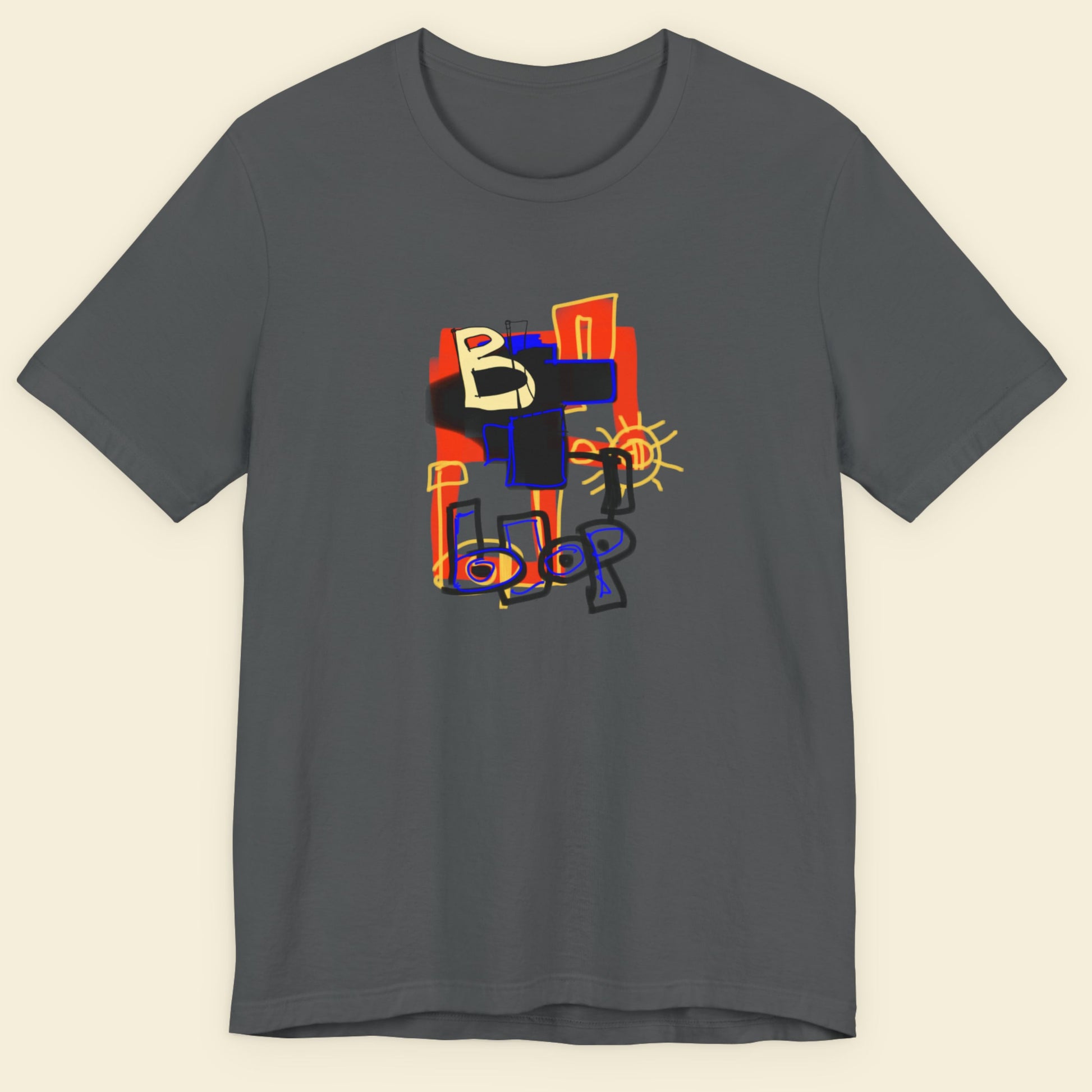 Grey t-shirt with a colorful abstract drawing on a beige background.