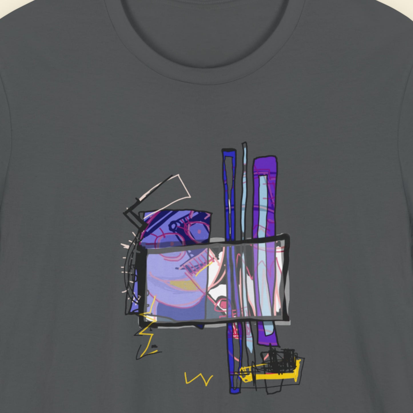 Dark grey t-shirt with a colorful abstract drawing on a beige background.