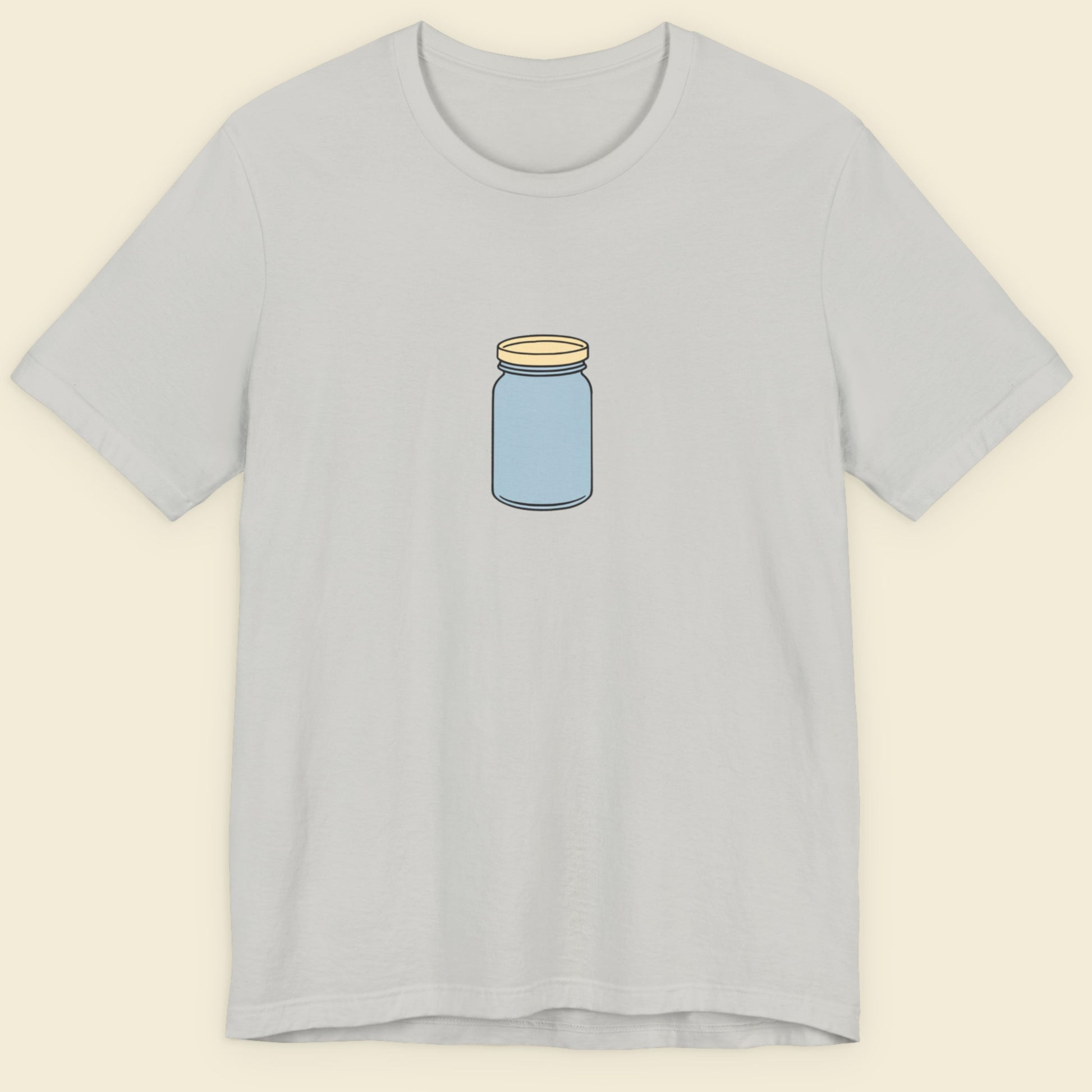 Gray t-shirt with a blue jar graphic on a beige background