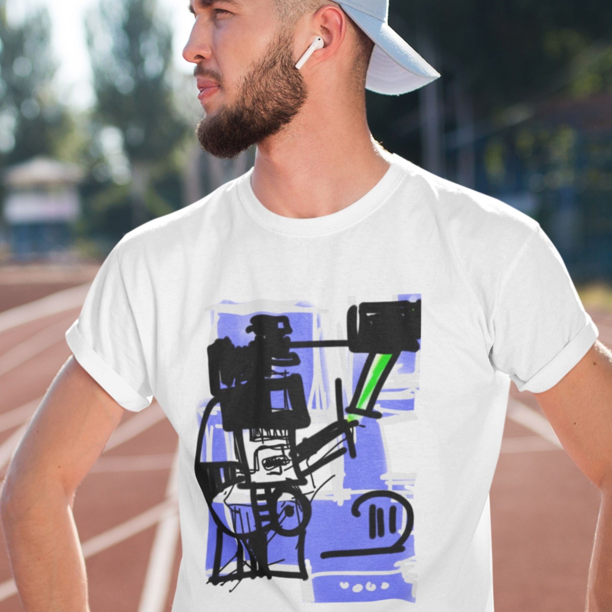 Man wearing a white t-shirt with a graphic design outdoors.