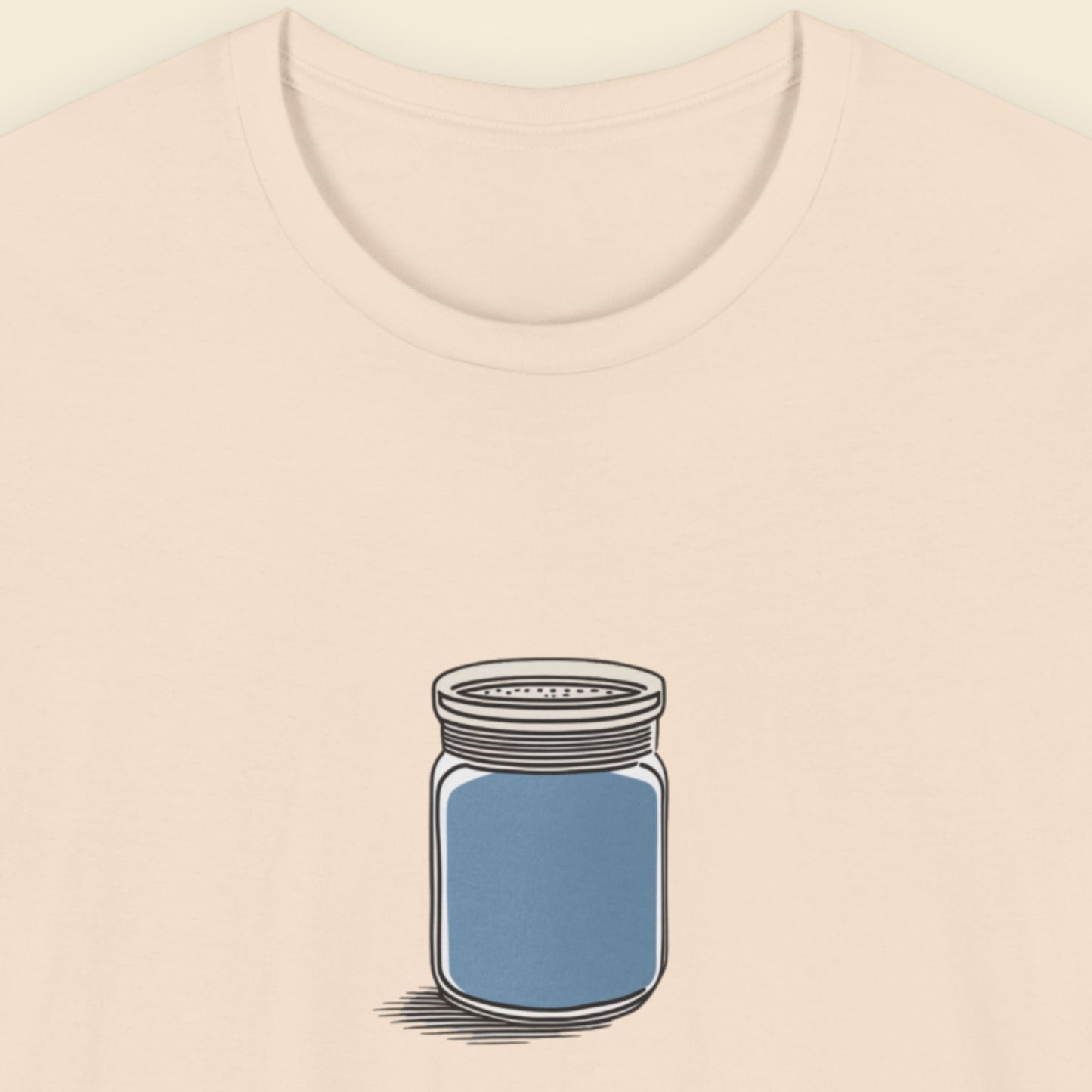 Beige shirt with a drawing of a blue shaker jar on a beige background.