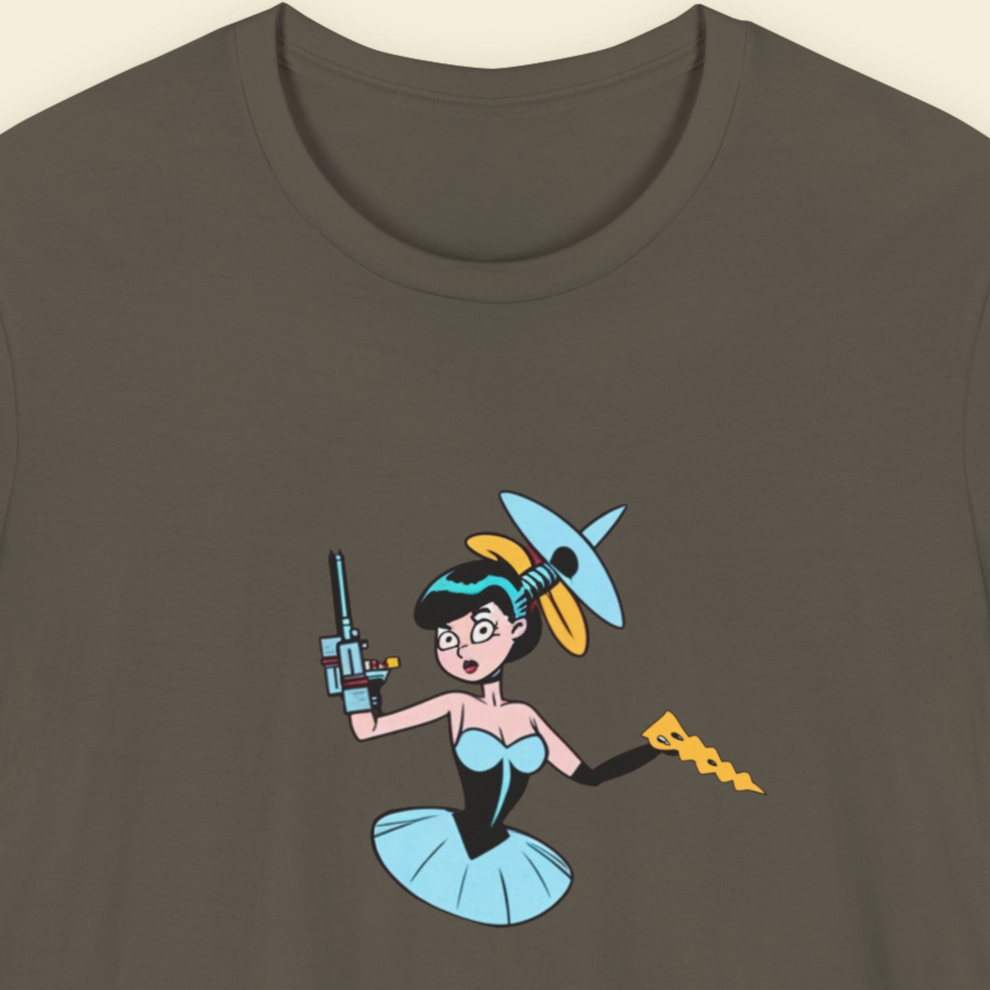 Army green shirt with a fun, colorful cyborg cartoon illustration on a beige background.