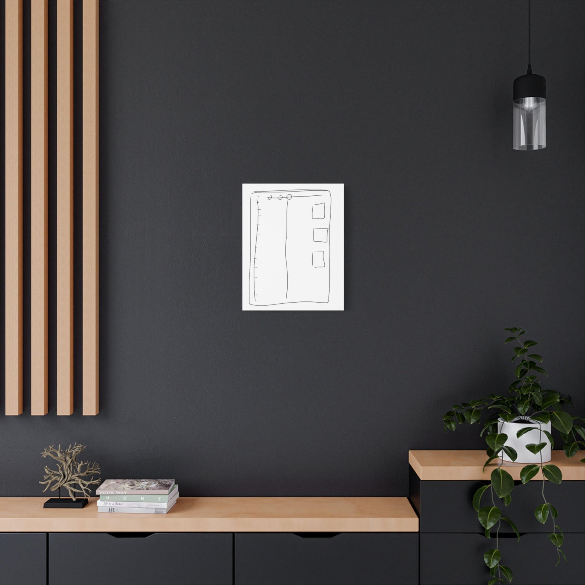 Simple minimalist art on a dark wall with a wooden shelf and plant.