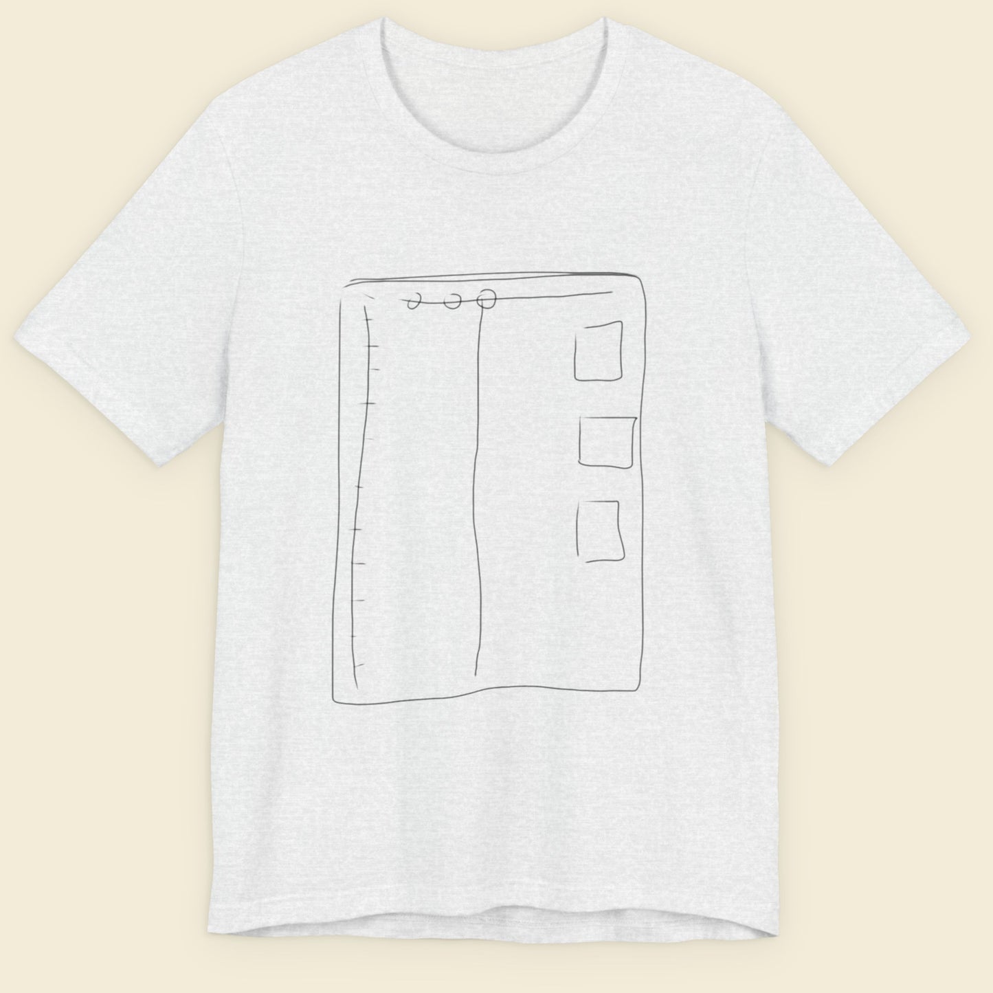 Ash grey t-shirt with a colorful abstract drawing on a beige background.