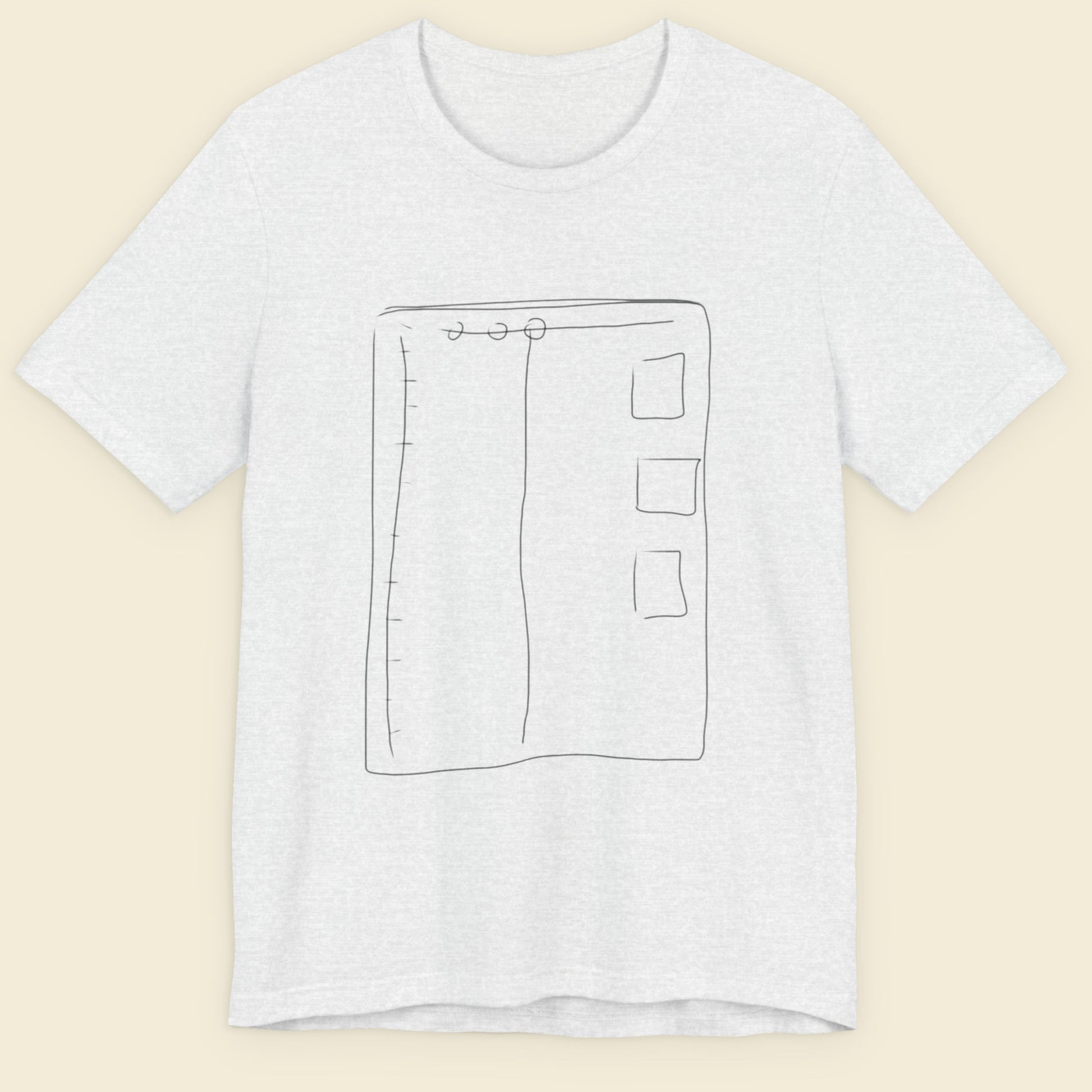 Ash grey t-shirt with a colorful abstract drawing on a beige background.